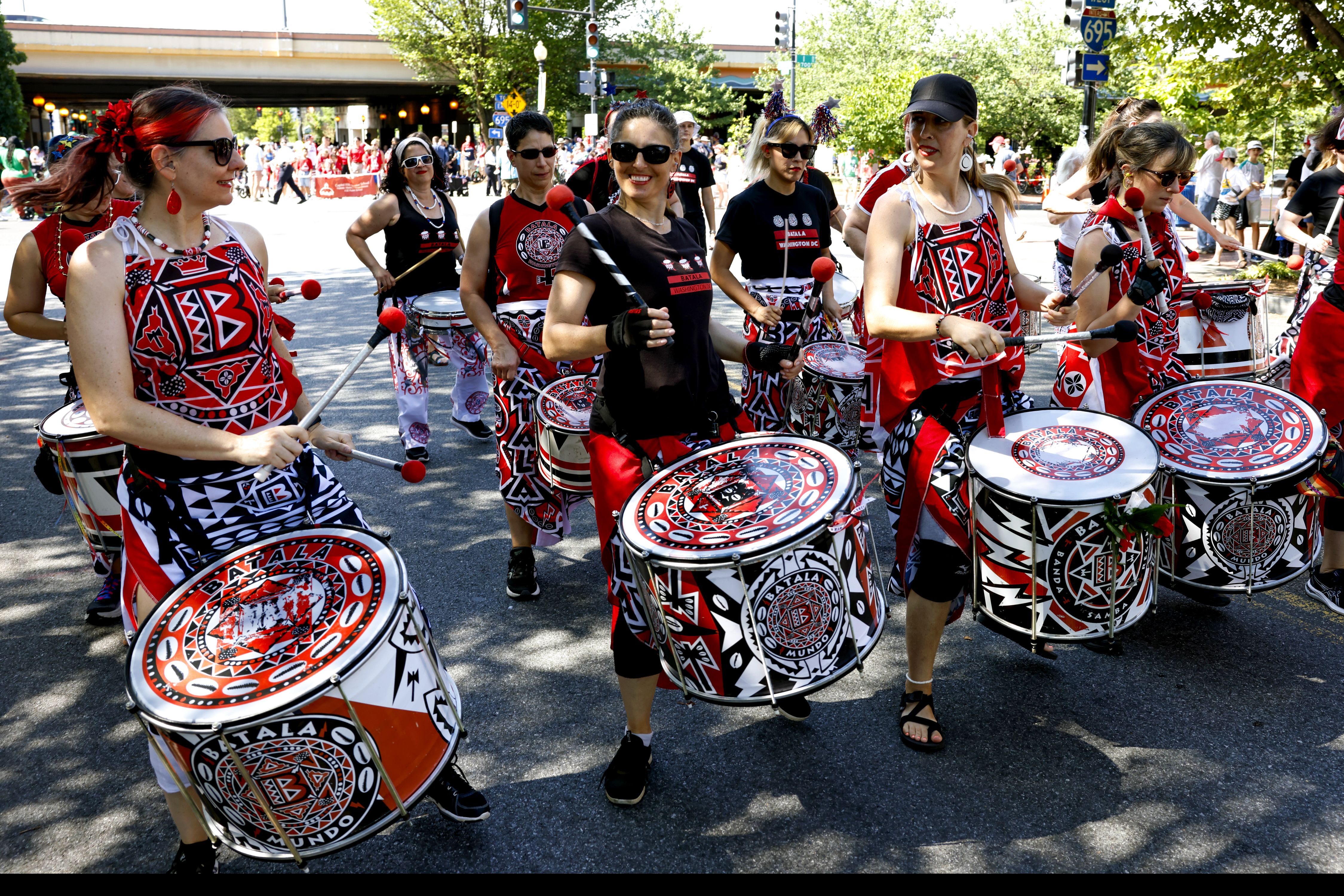 The Batala AFro Brazilian all women's drum group marches inThe Capitol Hill Community 4th of July Parade, in Washington DC. (Photo by Robb Hill for The Washington Post via Getty Images)