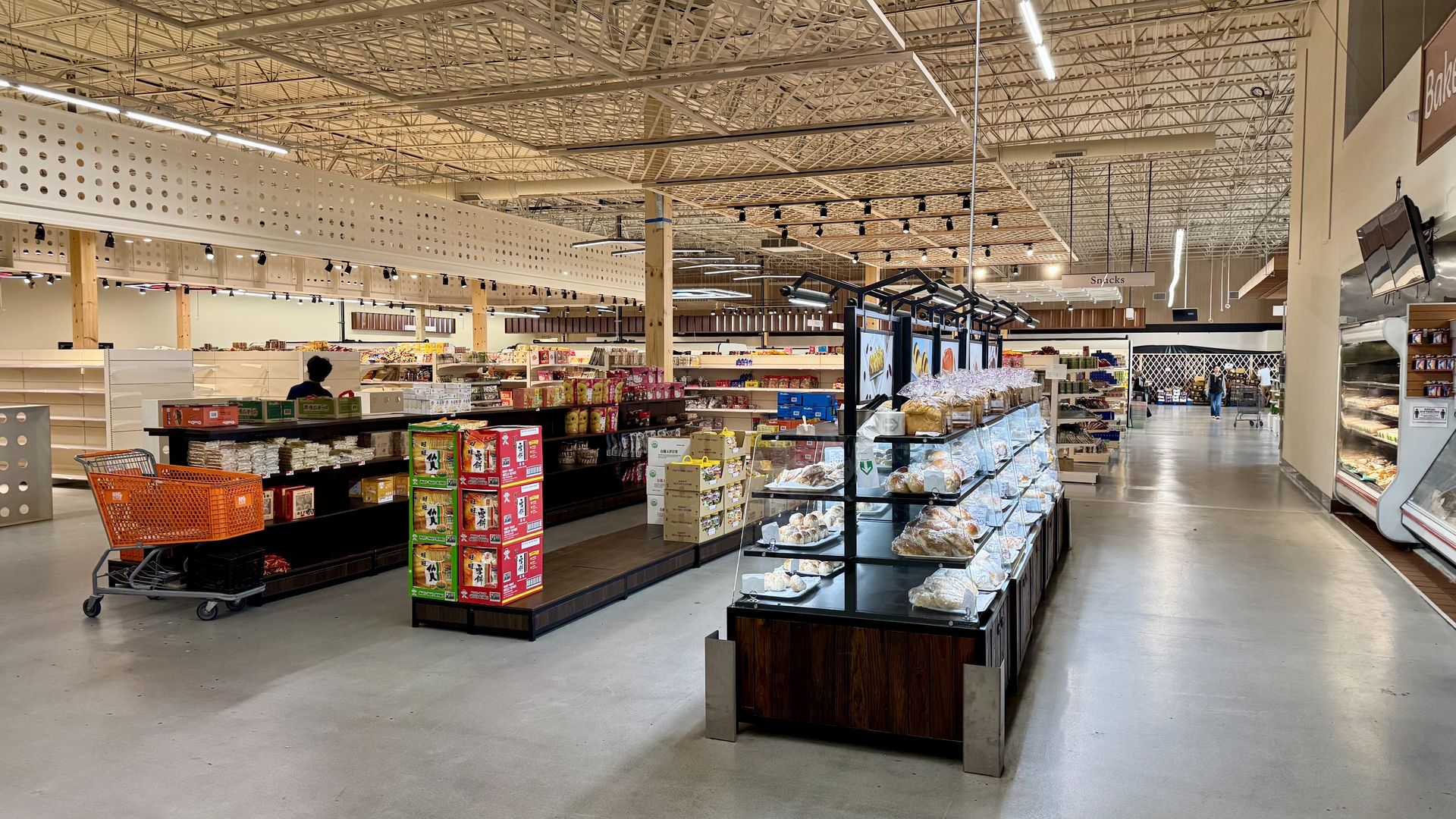 A giant space is shown with products on shelves. 