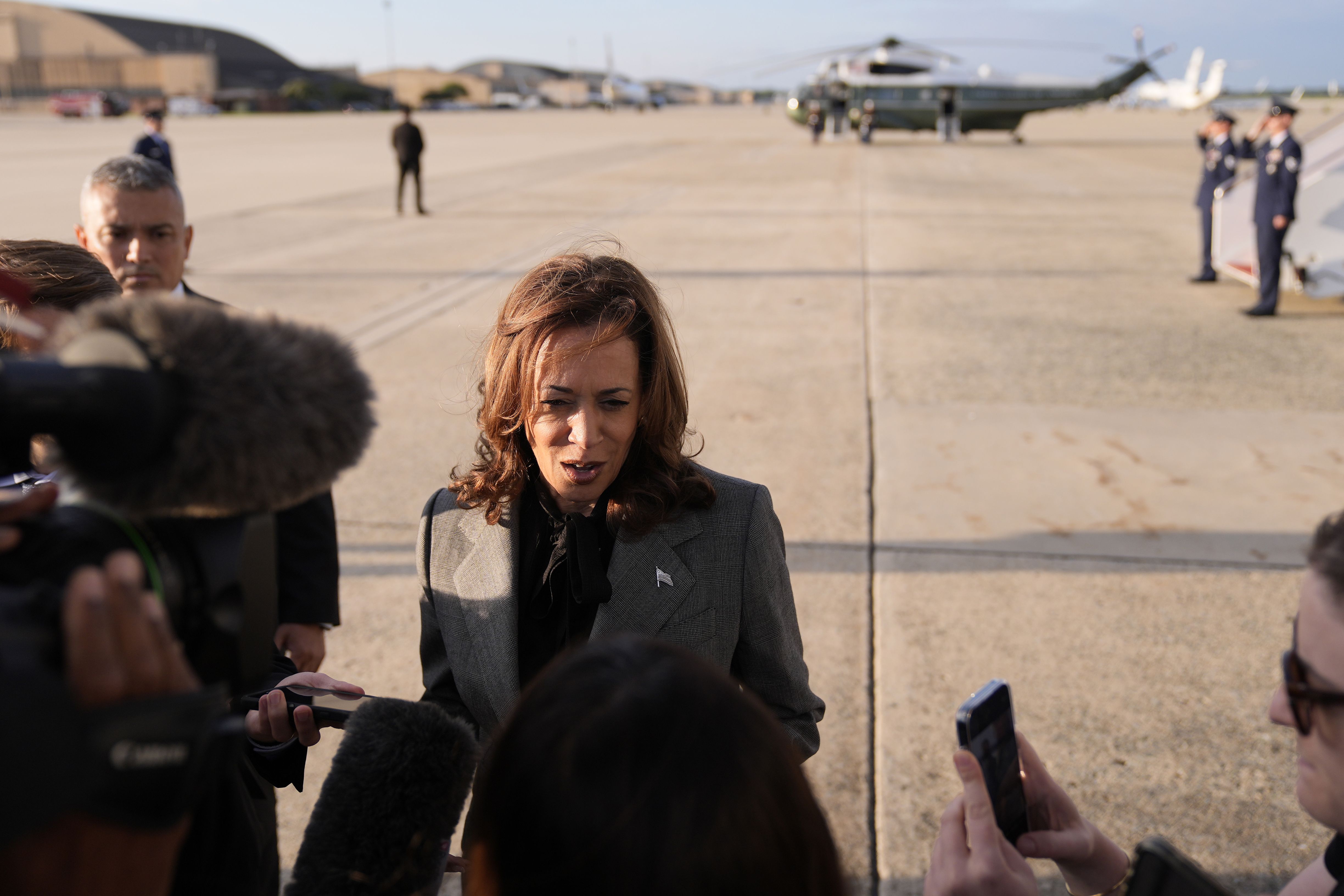 Vice President Harris speaks to members of the media upon her arrival at Andrews Air Force Base on Sunday.