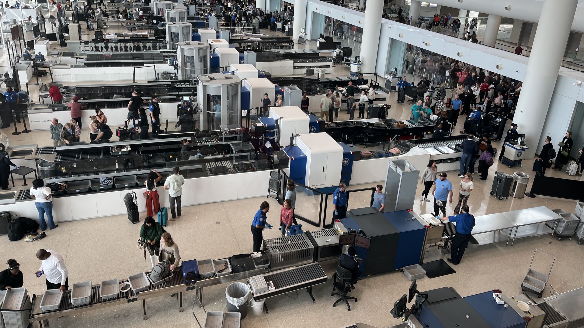 Photo shows the security screening lanes at New Orleans airport.