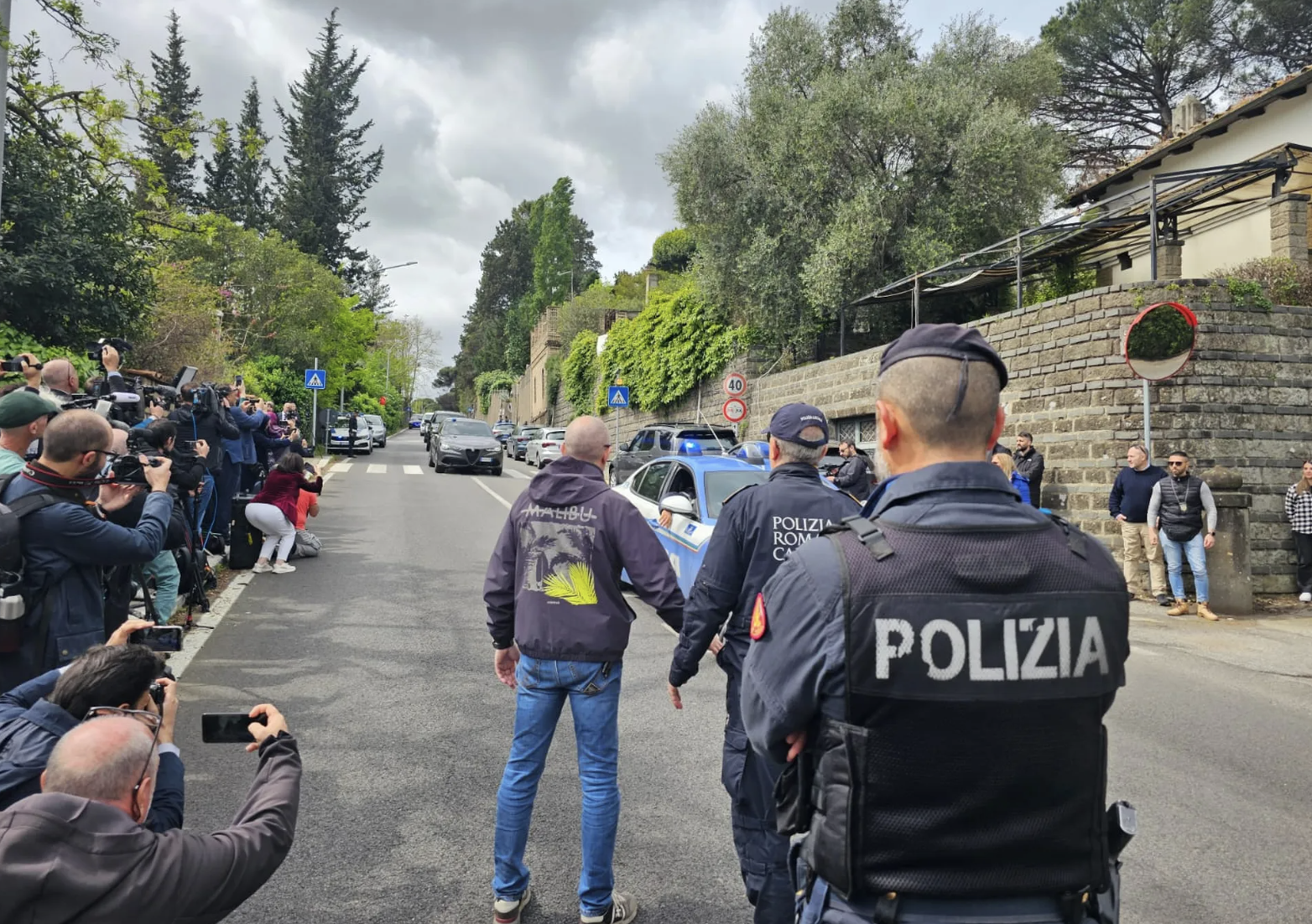 Reporter in narrow street