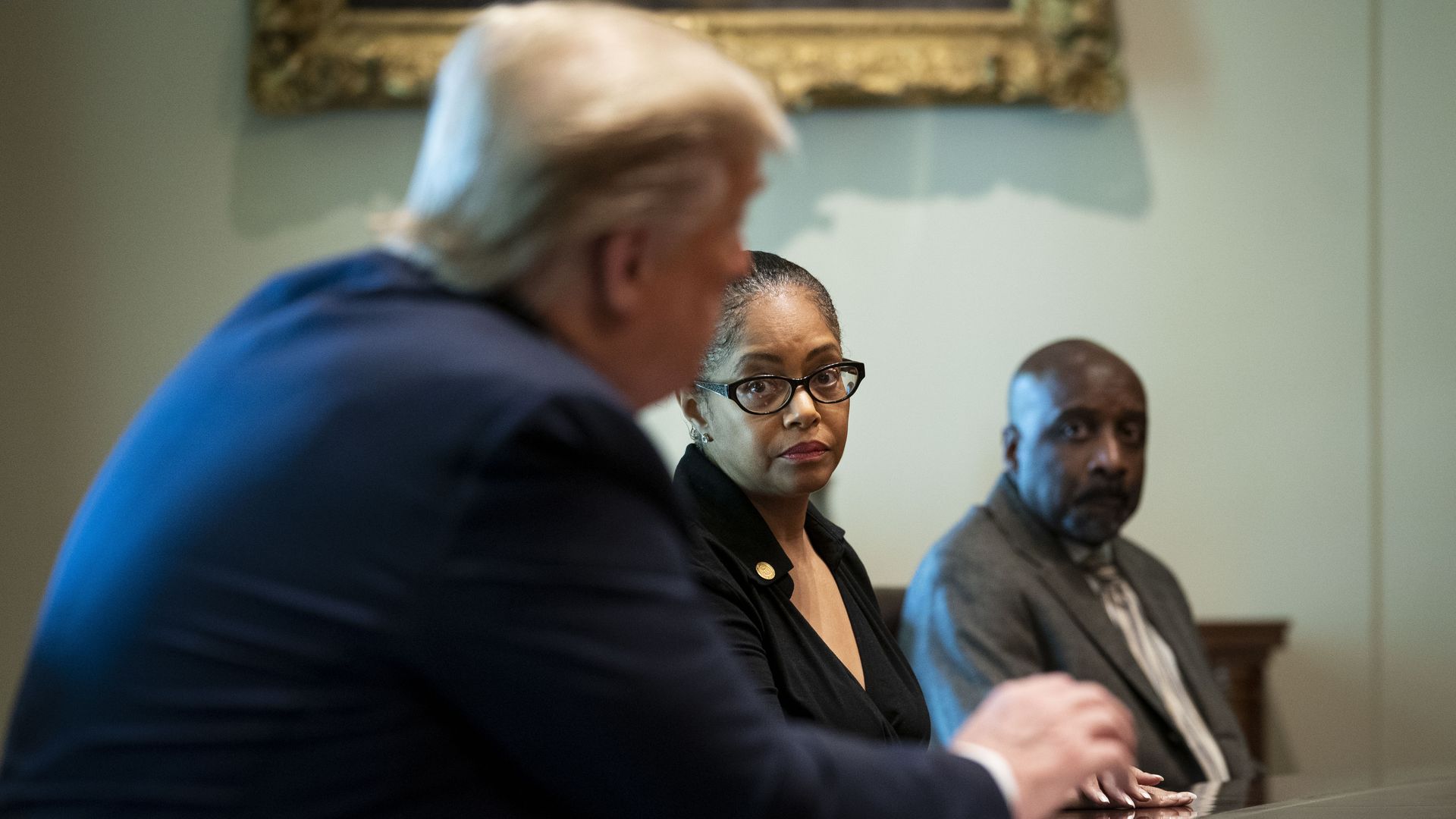 Rep. Karen Whitsett (D-Detroit) listens while then-President Donald Trump, left, speaks during a meeting in 2020.