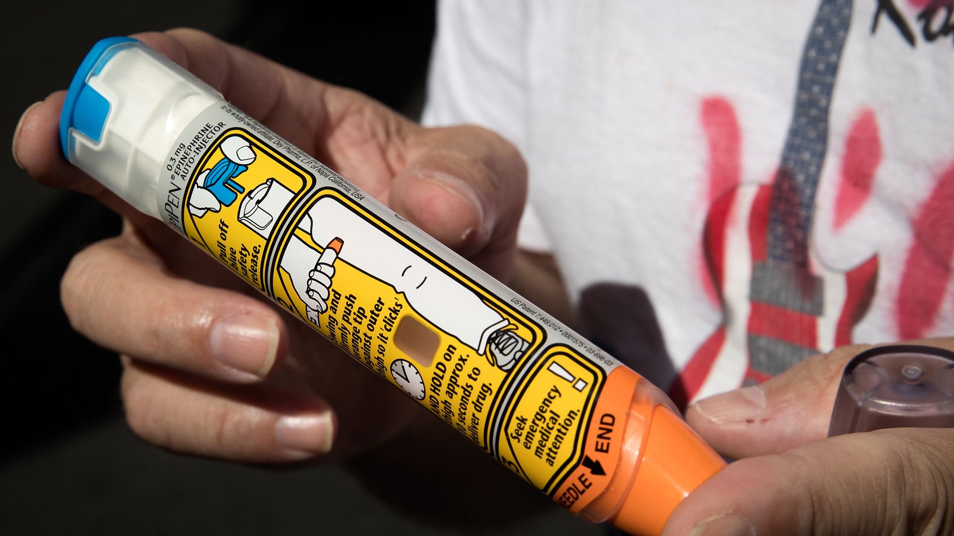 Man holding epipen