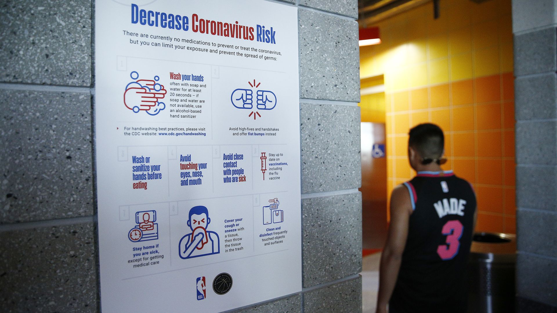  A detailed view of a coronavirus poster outside men's restroom prior to the game between the Miami Heat and the Charlotte Hornets at American Airlines Arena on March 11, 2020 in Miami, Florida.