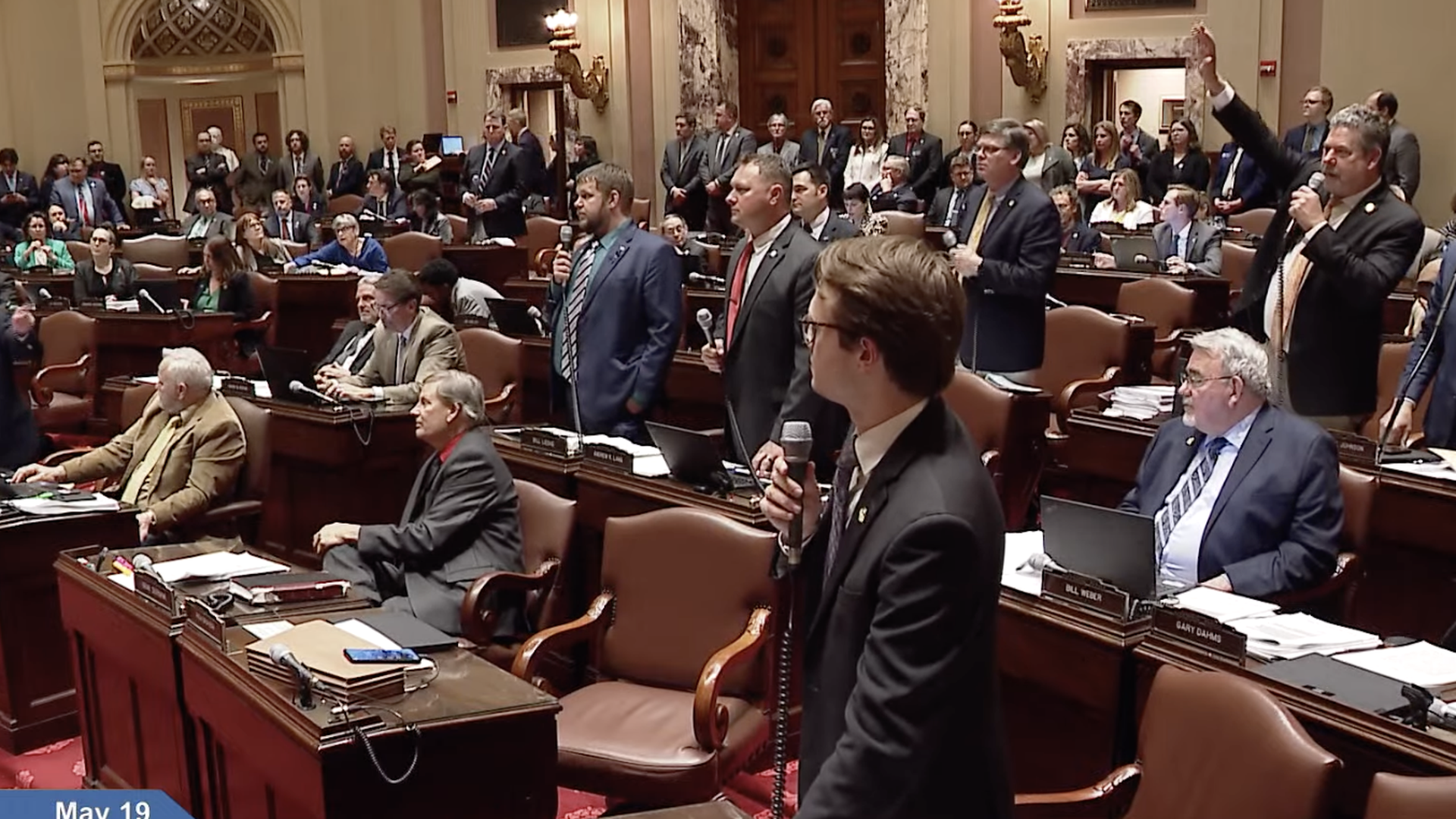 people stnading in the chamber