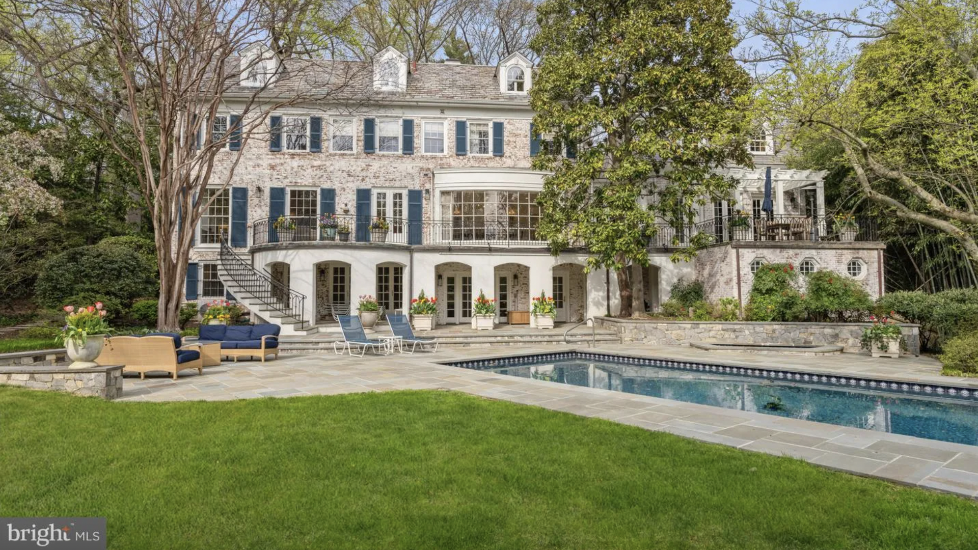 brick house with a pool
