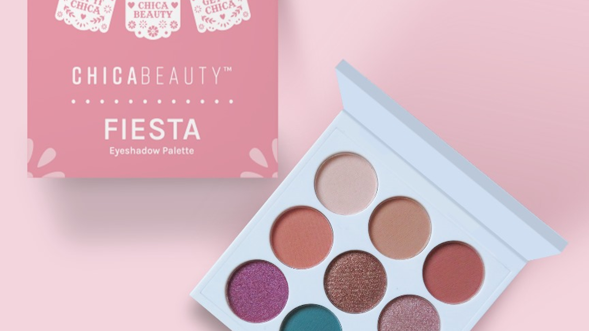 A makeup palette with nine shades sits by its pink box.