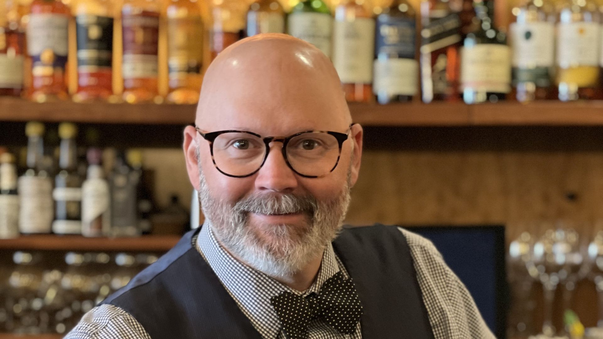 Shannon Healy stands behind the bar at Durham's Alley Twenty Six. 