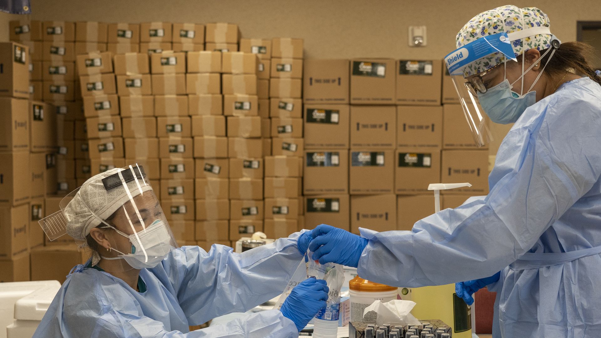 Medical workers handling coronavirus test samples in Houston on July 17.