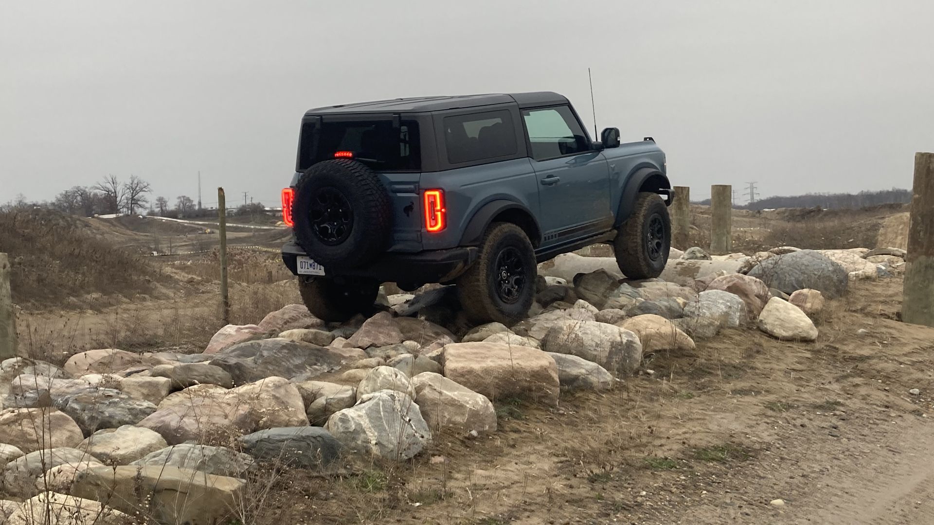 Image of the author driving a 2022 Ford Bronco over rocky terrain