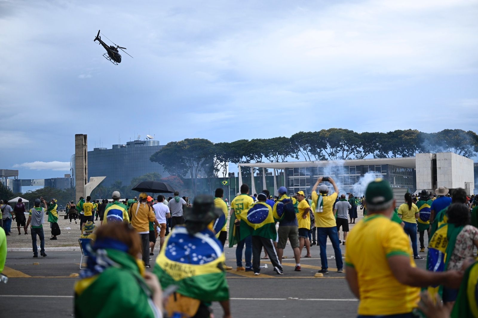 A helicopter flying over Bolsonaro supporters outside the National Congress building in Brasilia on Jan. 8.