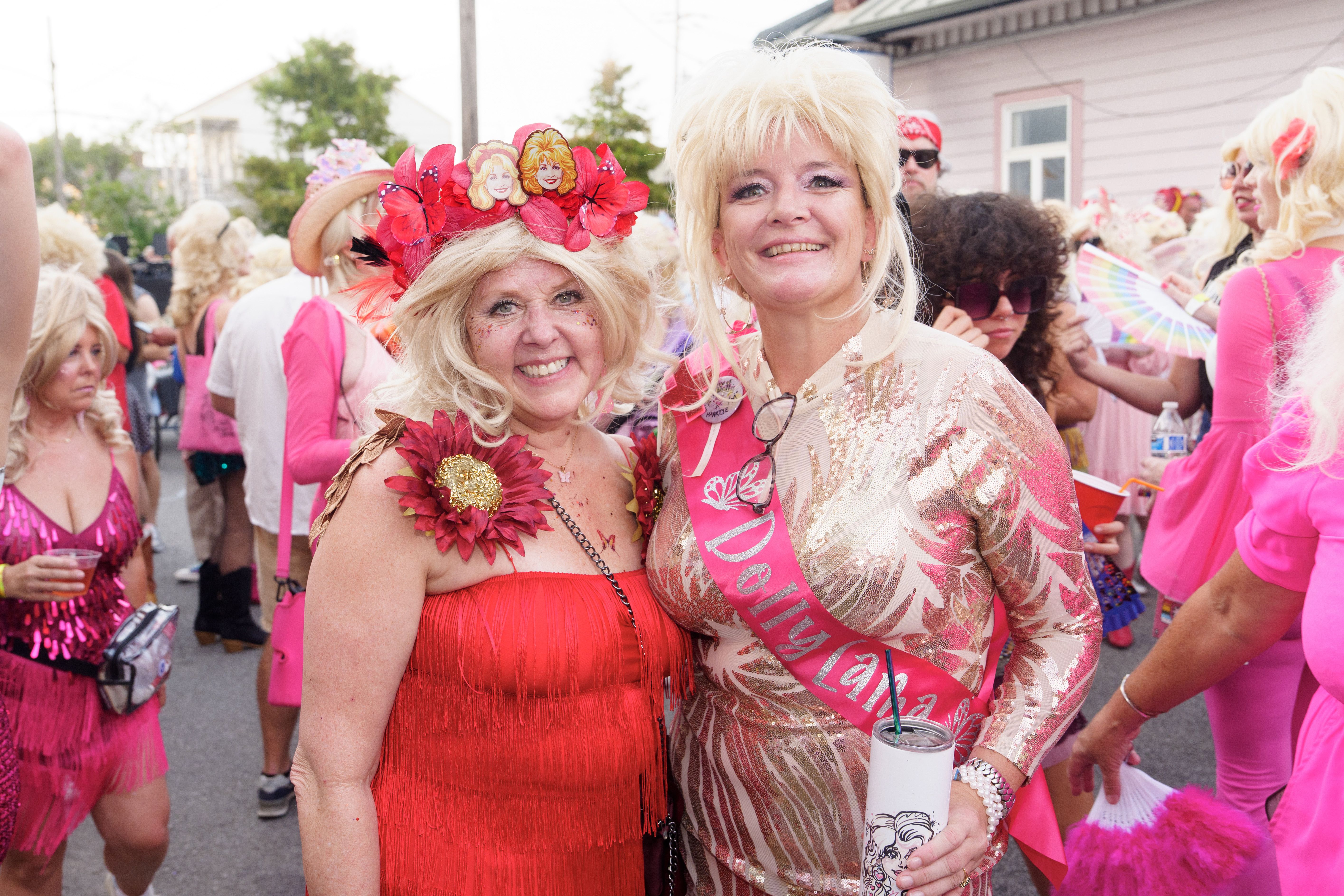 Image shows two people dressed as Dolly Parton.