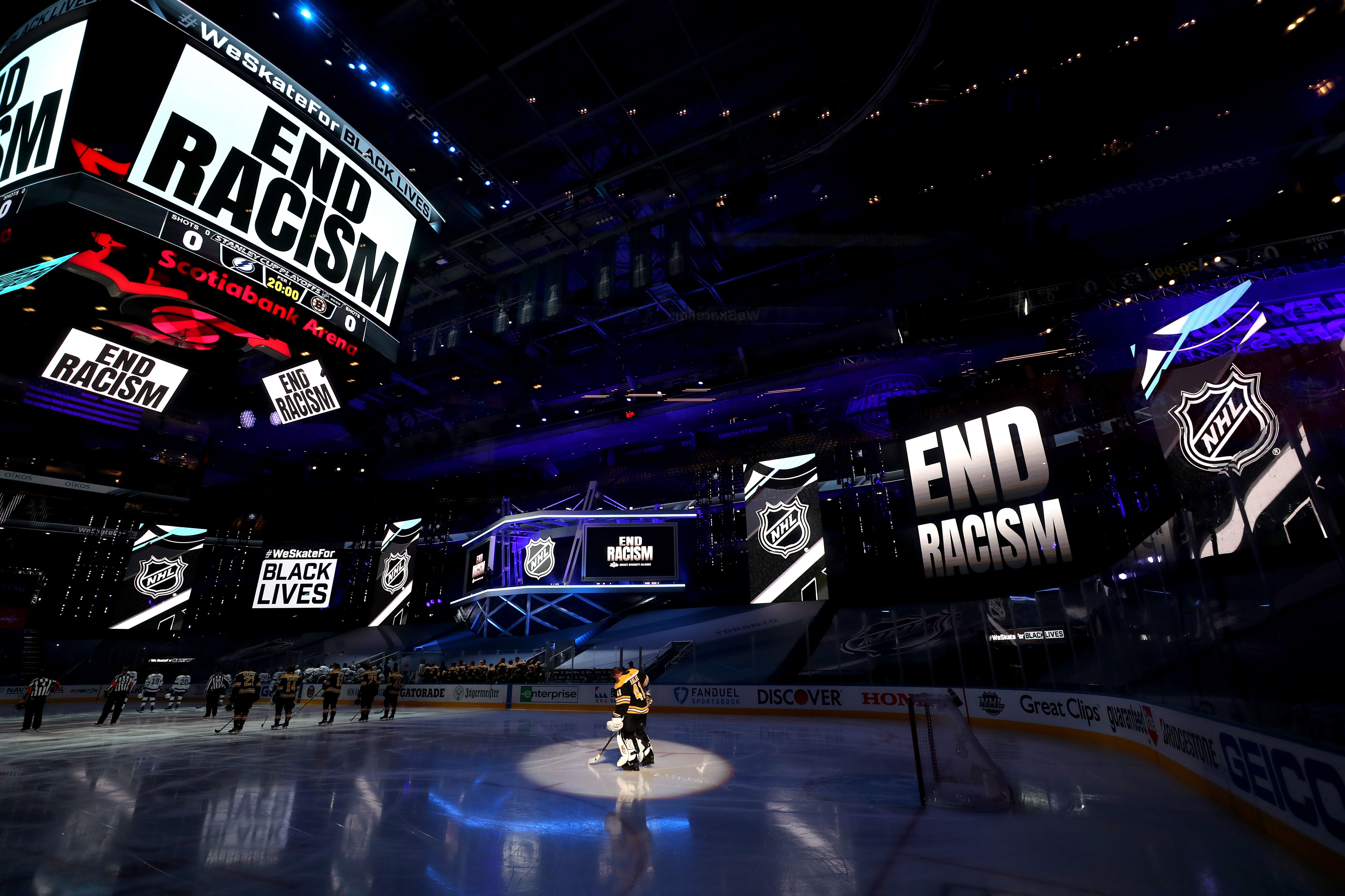 Pregame hockey with "End Racism" on arena screens