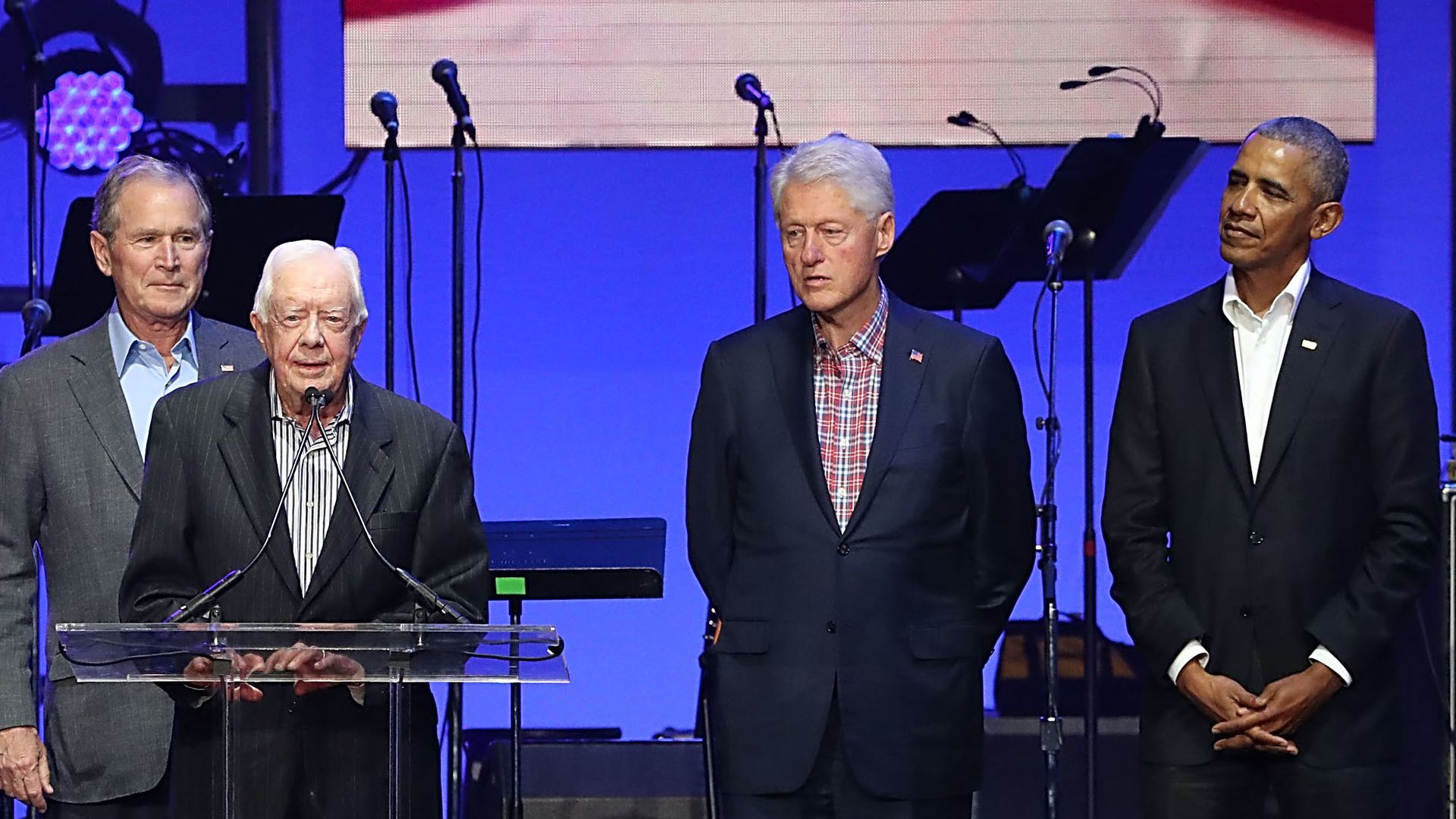  Former Presidents George W. Bush, Jimmy Carter, Bill Clinton and Barack Obama address the audience during a 2017 concert at Reed Arena in College Station, Texas. Photo: Gary Miller/Getty Images