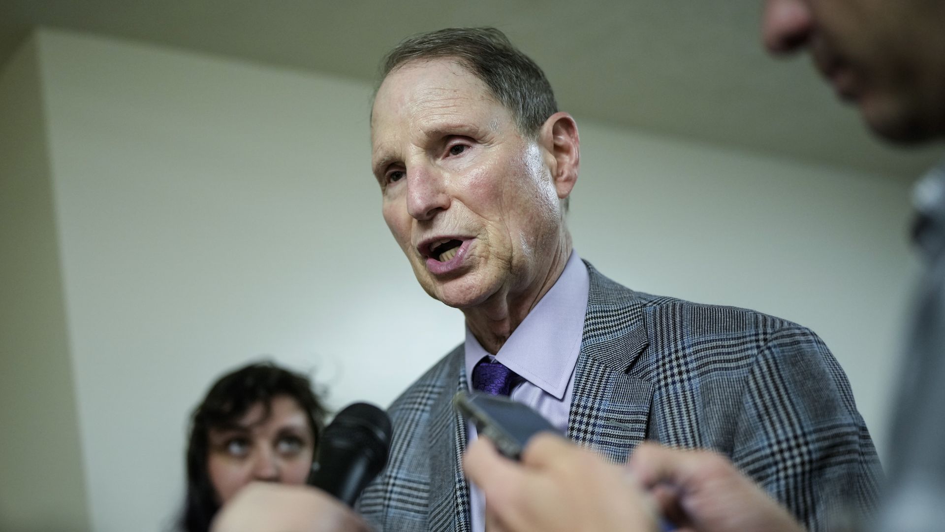 Senator Ron Wyden talks to reporters