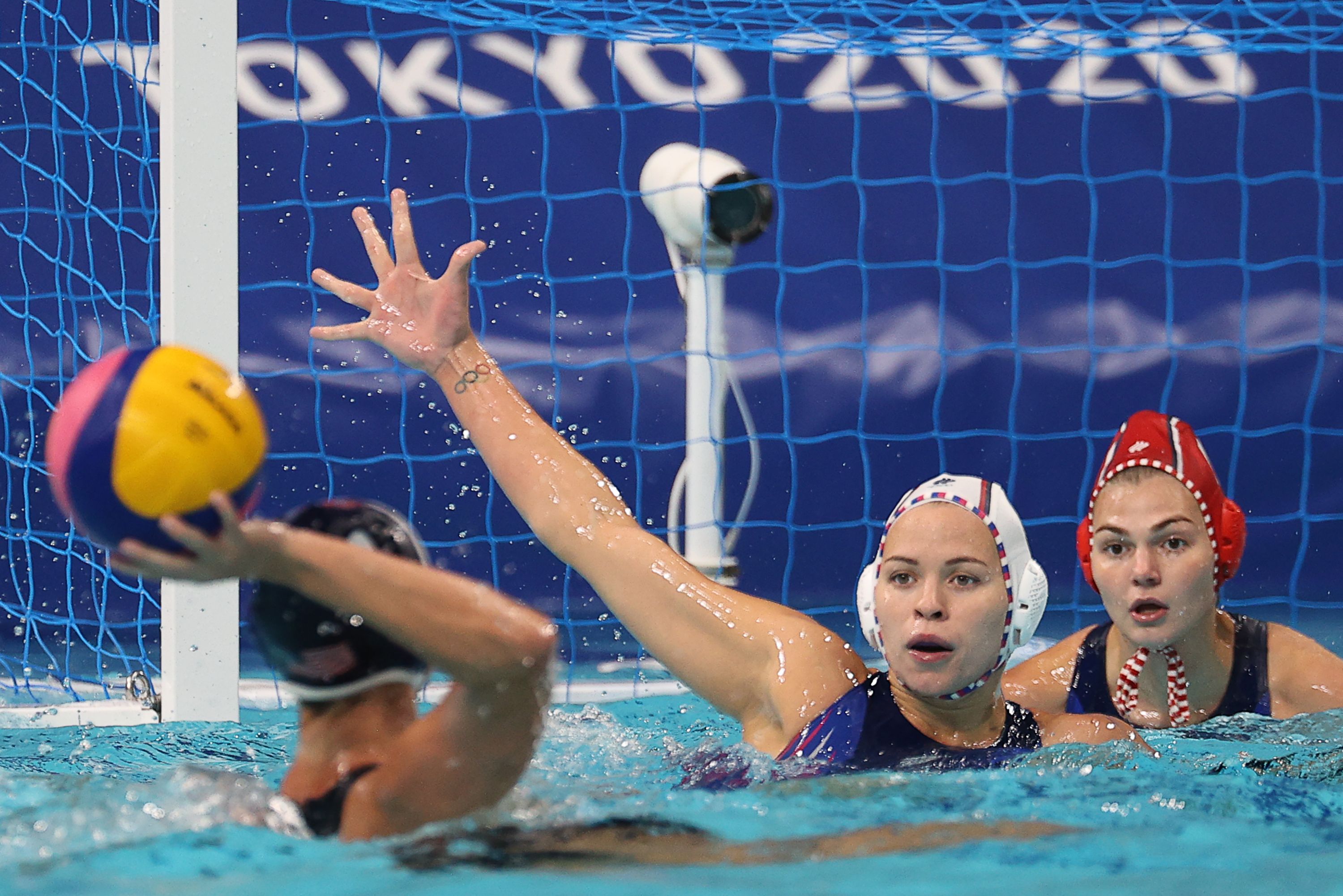 The USA's Madeline Musselman, ROC's Anna Timofeyeva and Anastasia Fedotova (L-R) in a womens semifinal water polo match at the Olympic Games, at Tatsumi Water Polo Centre.