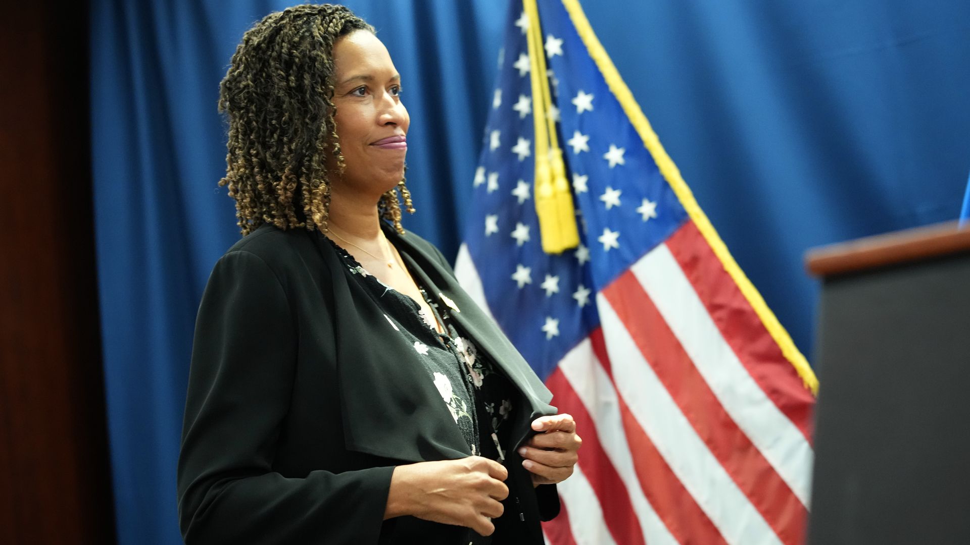 Mayor Muriel Bowser walks toward a podium at a press conference