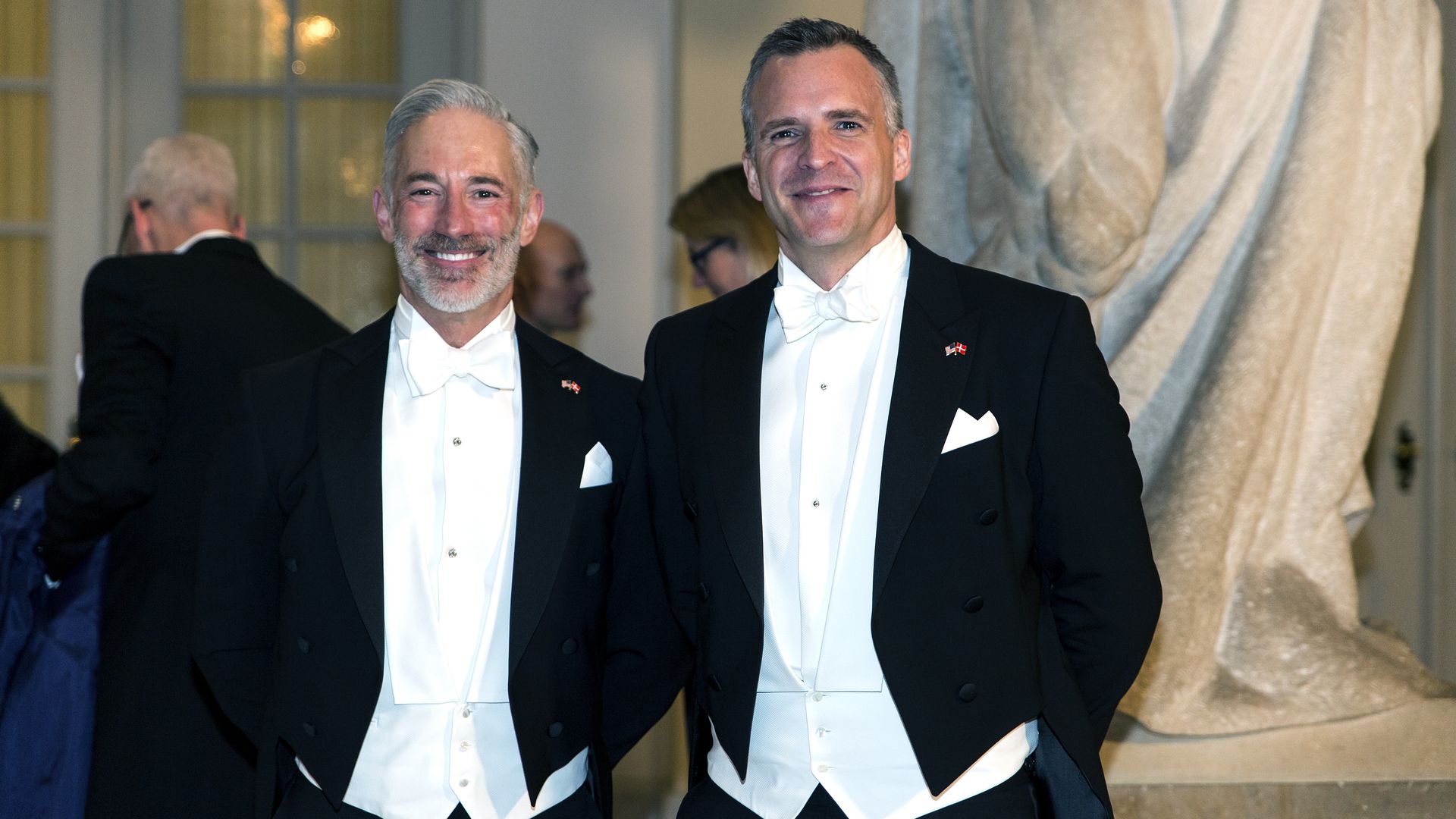 Rufus Gifford is seen with his spouse, Stephen Devincent, during a formal reception in Denmark.