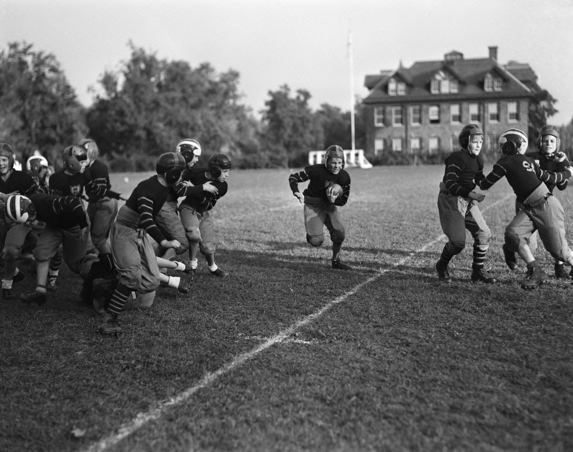 Kids playing football.
