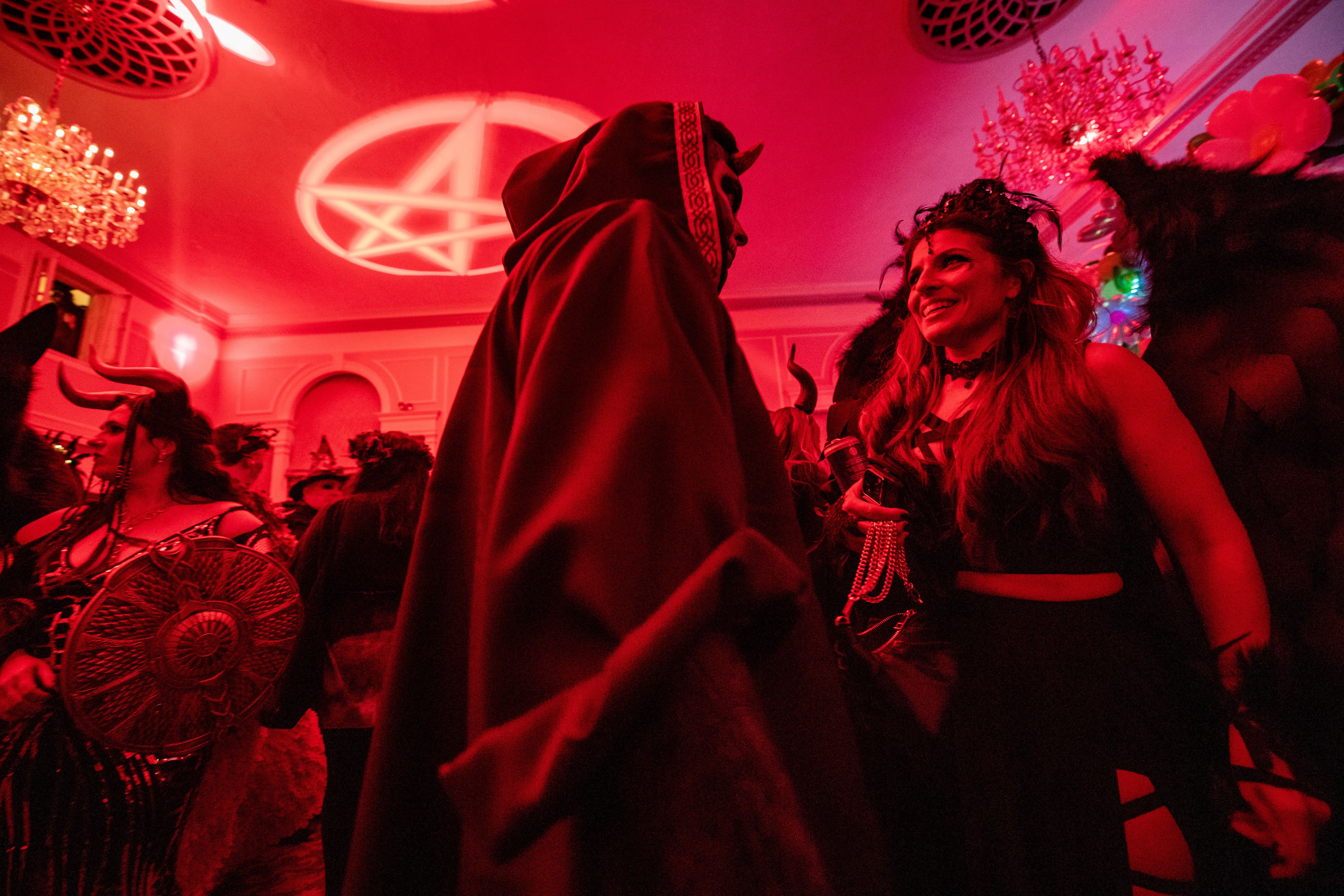 Revelers dance at a witch themed ball in Salem.