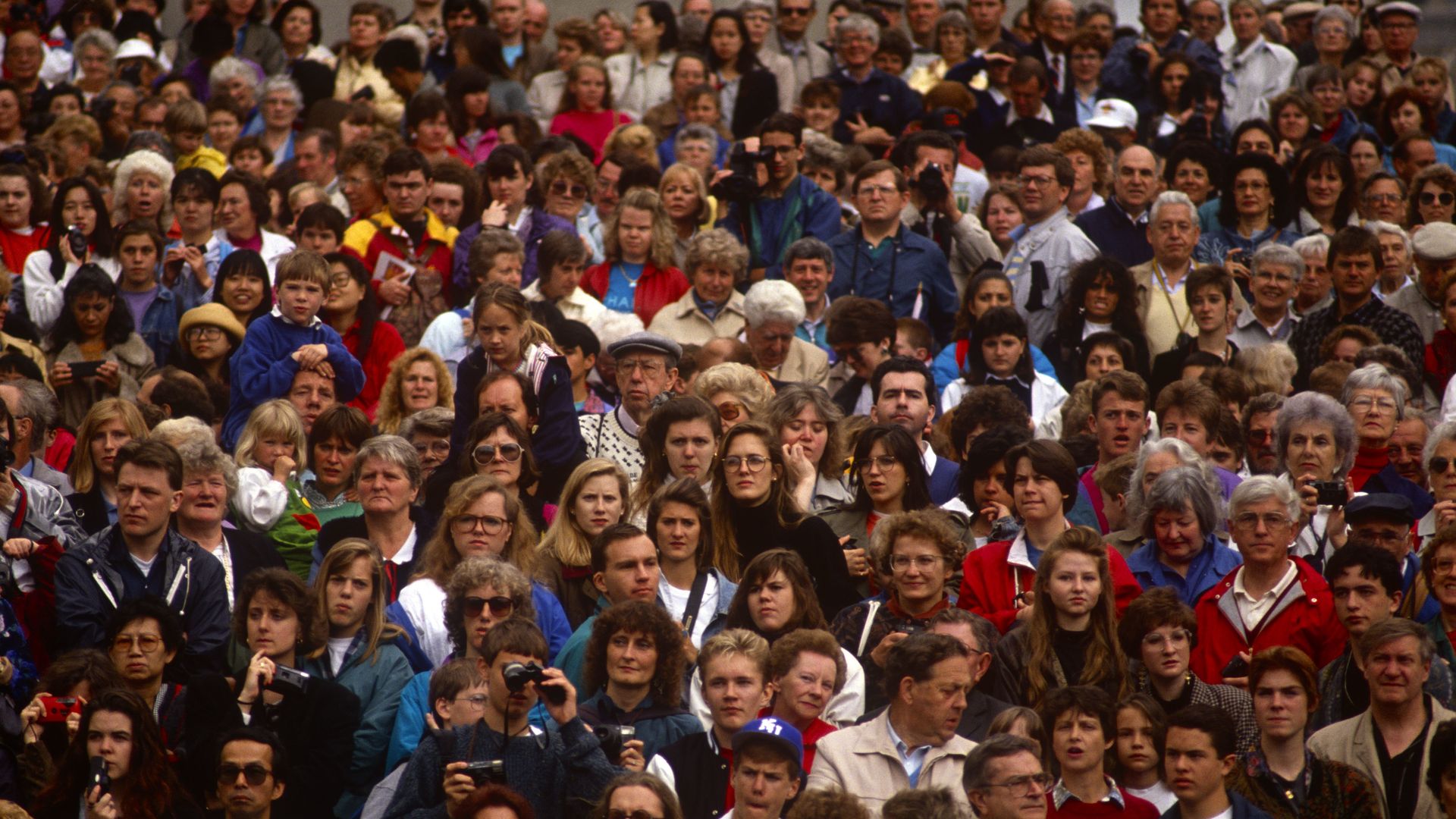 Diverse faces in a crowd of people