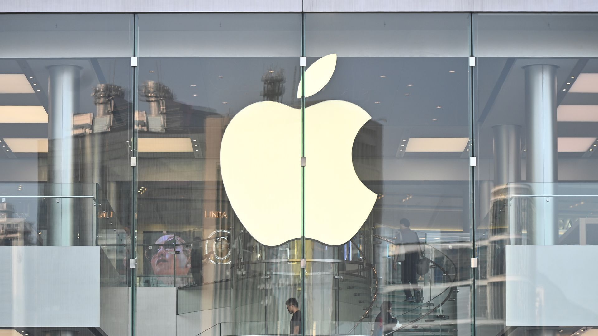 photo of Apple logo on doorway of Apple Store