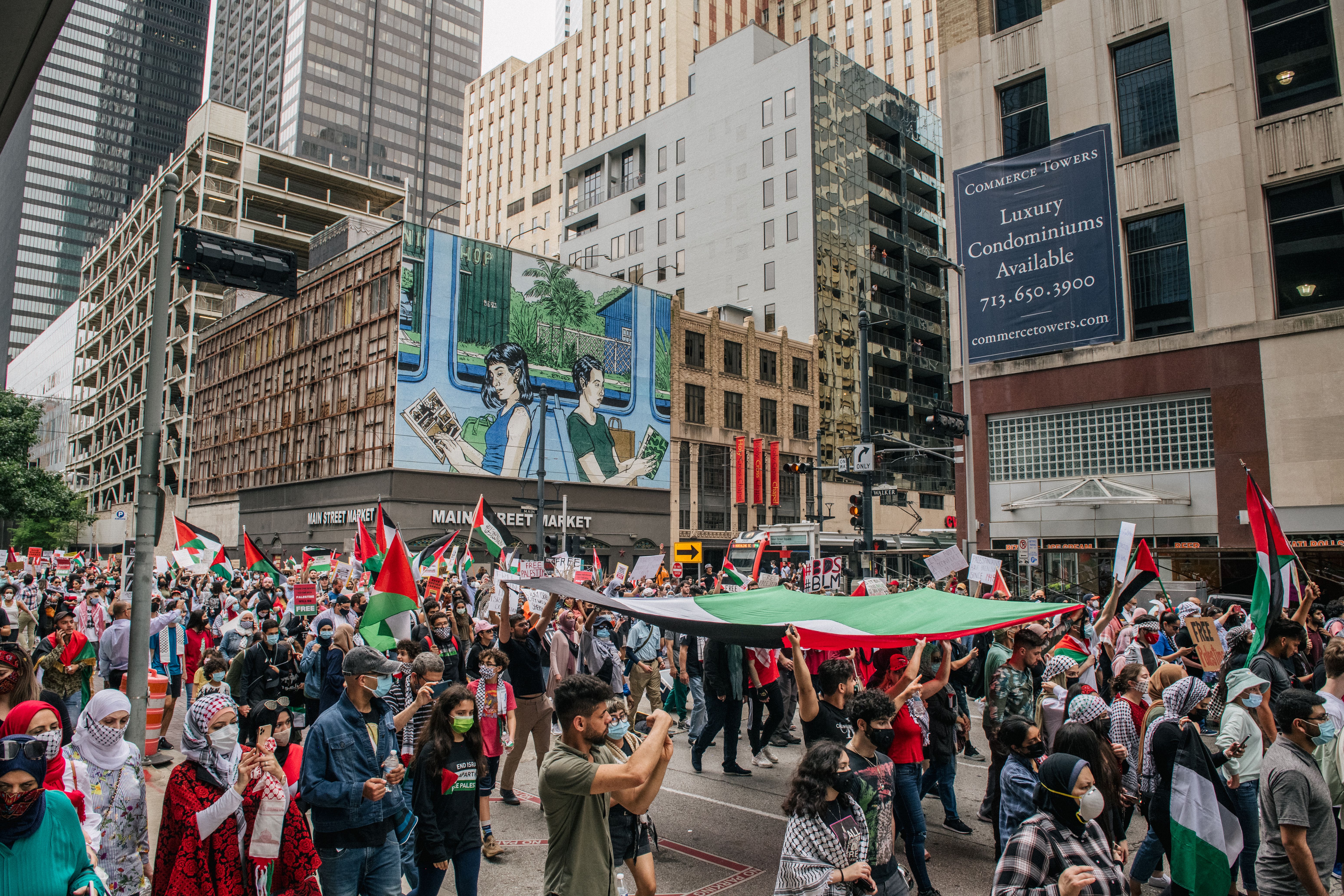 People carry the Palestinian flag during a march to the Houston City Hall on May 15, 2021 in Houston, Texas.
