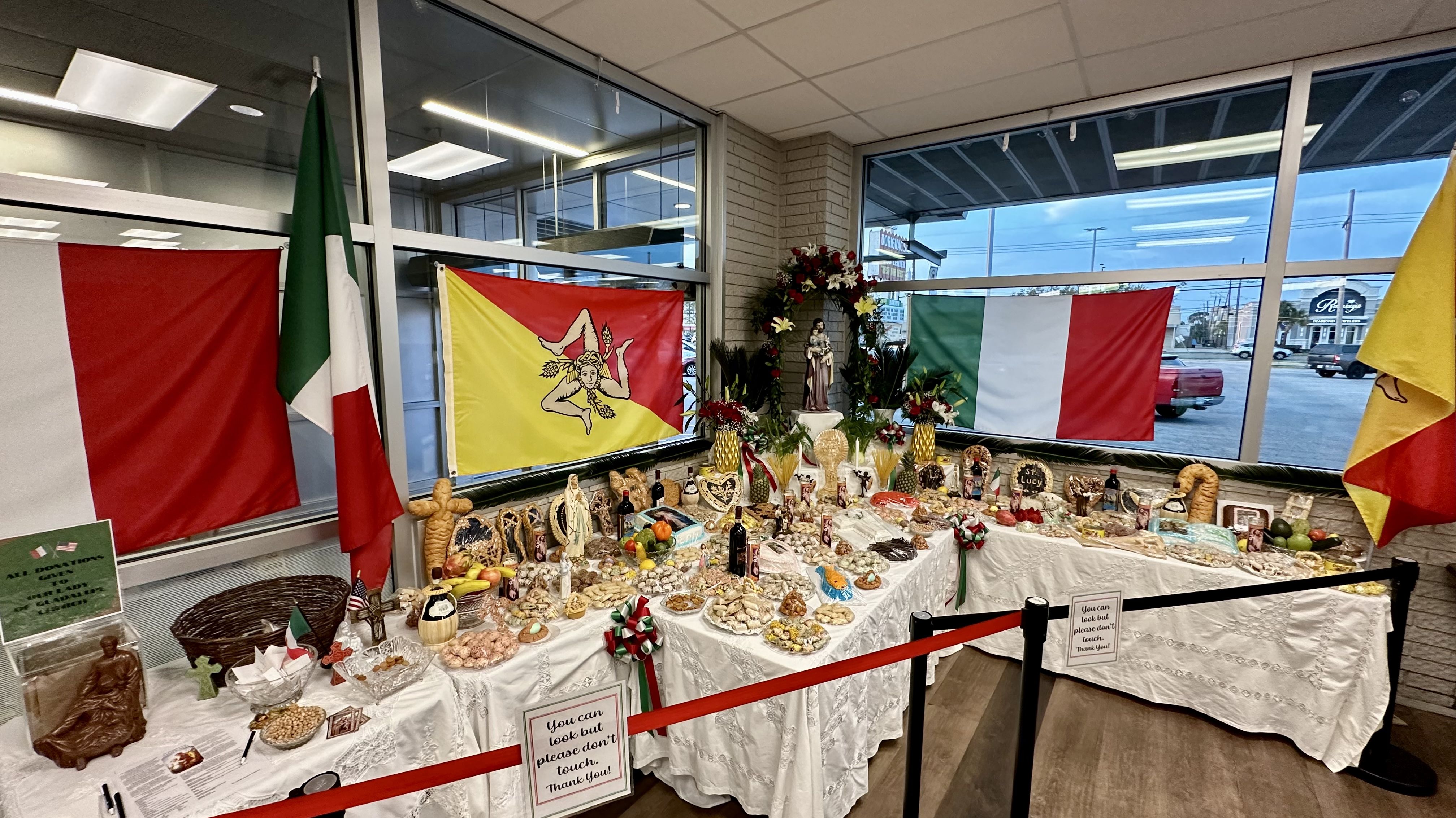 Photo shows the St. Joseph's Day altar at Dorignac's with flags from Italy and Sicily.