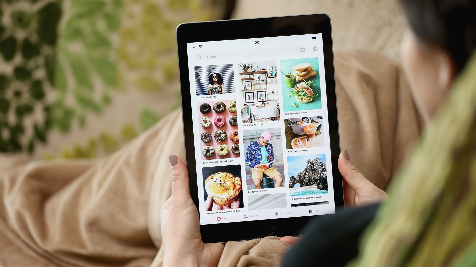 A person browsing Pinterest on a tablet