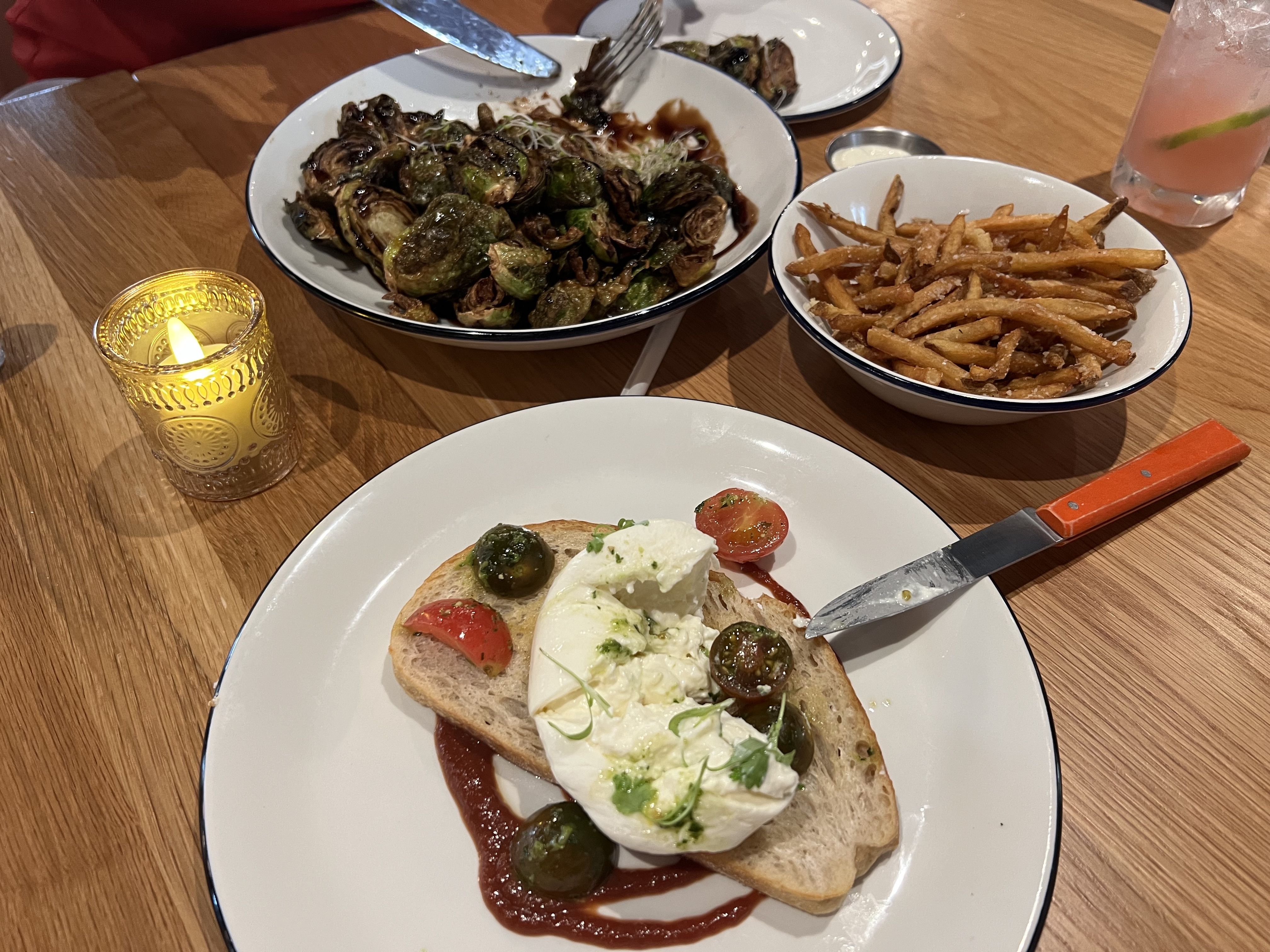 fries, brussel sprouts, cheese on bread