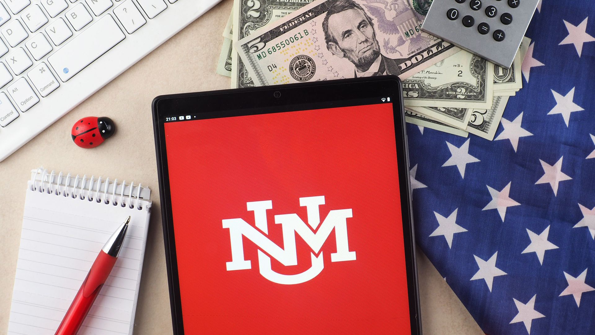 In this photo illustration, the University of New Mexico logo seen displayed on a tablet.