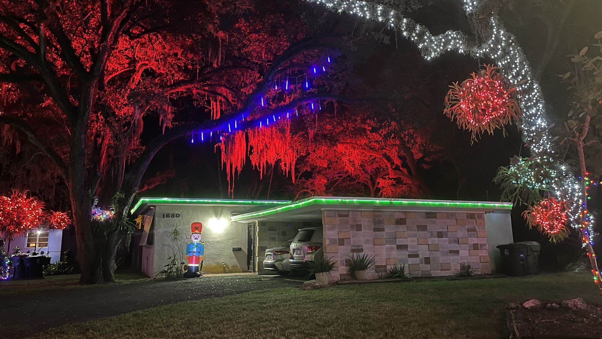 Christmas decorations and lights adorn a home at Enchanted Place in North Miami.