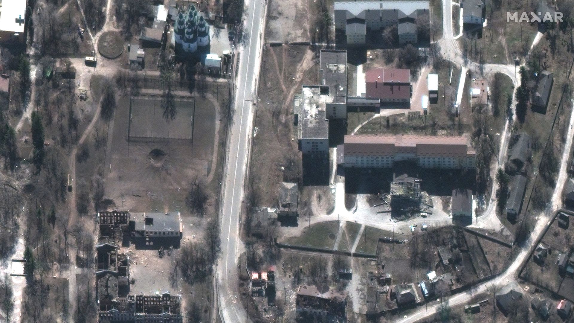 Maxar closeup satellite imagery of damaged buildings and the hospital, downtown Izyum, Ukraine.