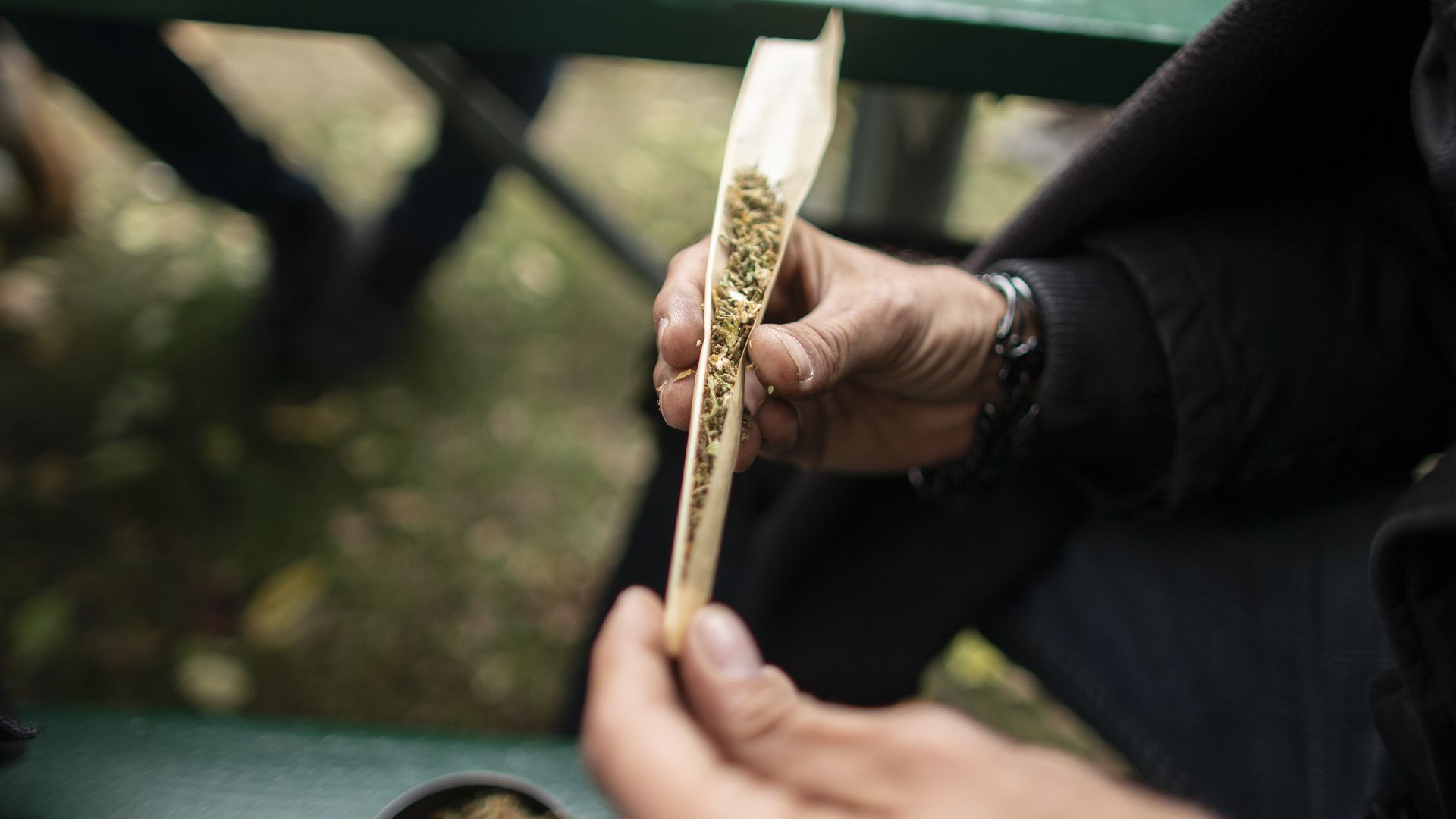 Man rolling marijuana joint