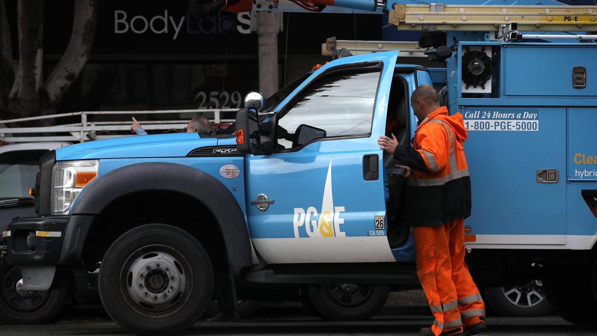 Photo of worker at PG&E truck