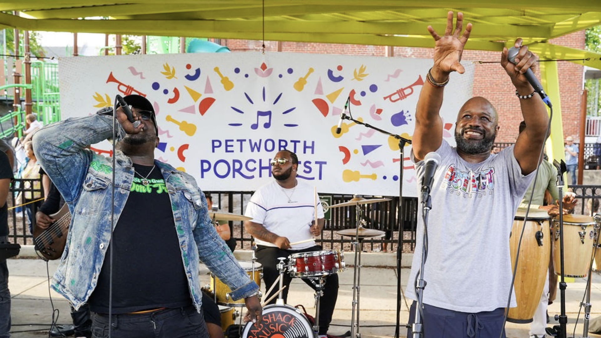 Three men performing at PorchFest.