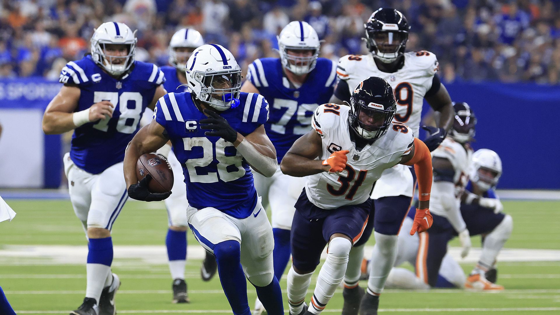 onathan Taylor #28 of the Indianapolis Colts rushes for a touchdown against the Chicago Bears during the second quarter of the game at Lucas Oil Stadium on September 22, 2024 in Indianapolis, Indiana. 