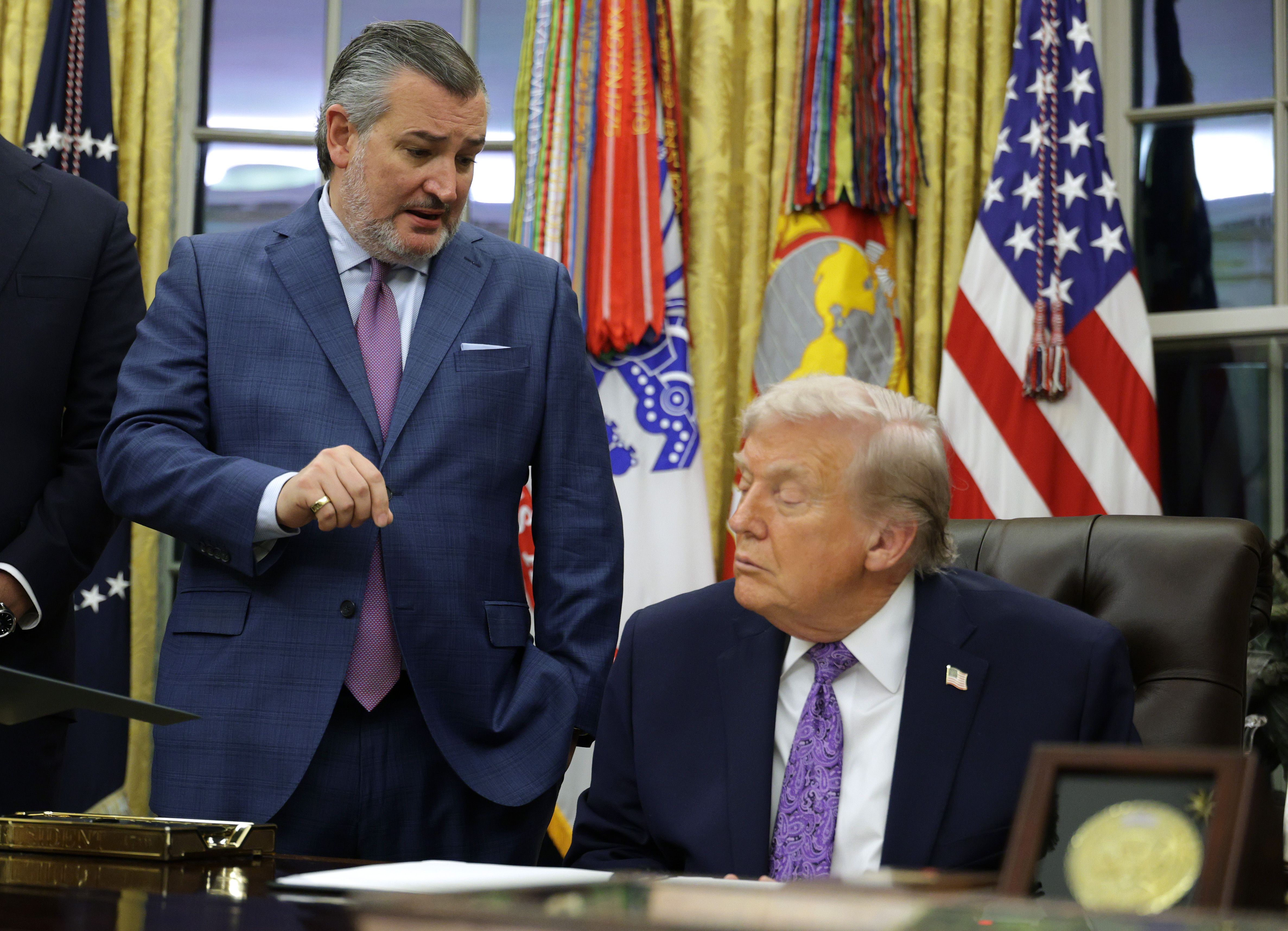 President Trump Signs Executive Orders In The Oval Office WASHINGTON, DC - DECEMBER 11: (L-R) U.S. Sen. Ted Cruz (R-TX) and President Donald Trump talk in the Oval Office of the White House on December 11, 2025 in Washington, DC. Trump signed an executive order that curbs states' ability to regulat