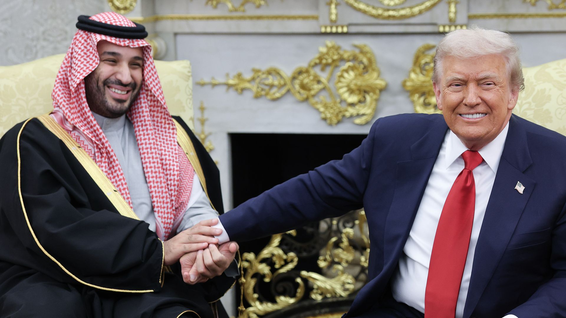 Saudi Crown Prince Mohammed Bin Salman and President Trump clasp hands at the White House. (Photo by Win McNamee/Getty Images)