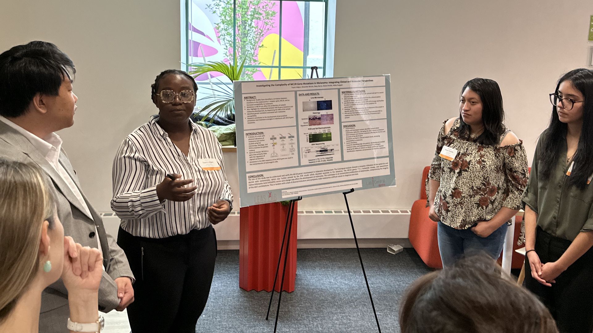 Toyosi Adigun, center left, is presenting the findings of her group's experiment to prospective employers. The group is part of the latest CareerForge job training cohort.