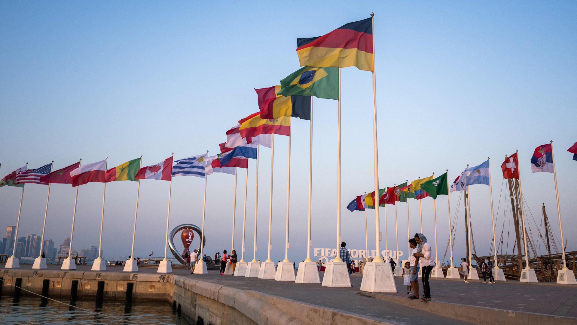 People visit the FIFA World Cup countdown clock in Doha on October 23