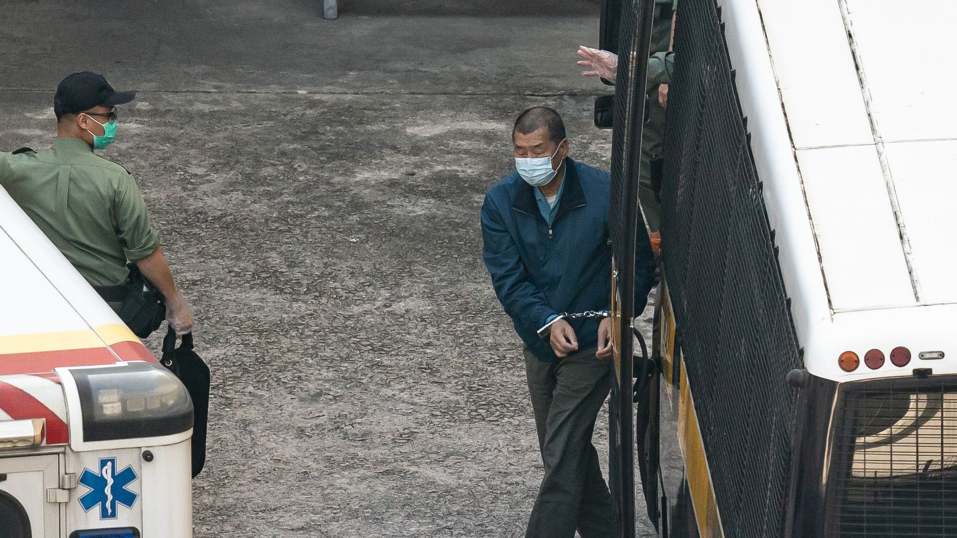 Jimmy Lai in handcuffs