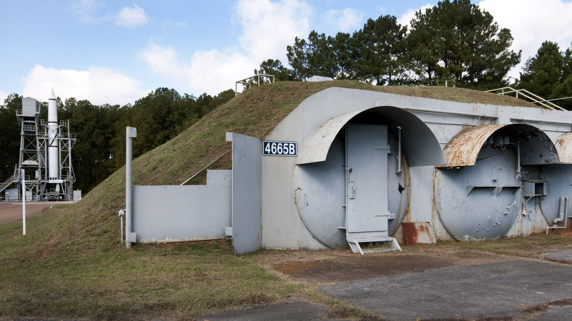 Bunkers and underground control rooms are shown in front of a rocket test stand at Redstone Arsenal in Huntsville, Alabama.