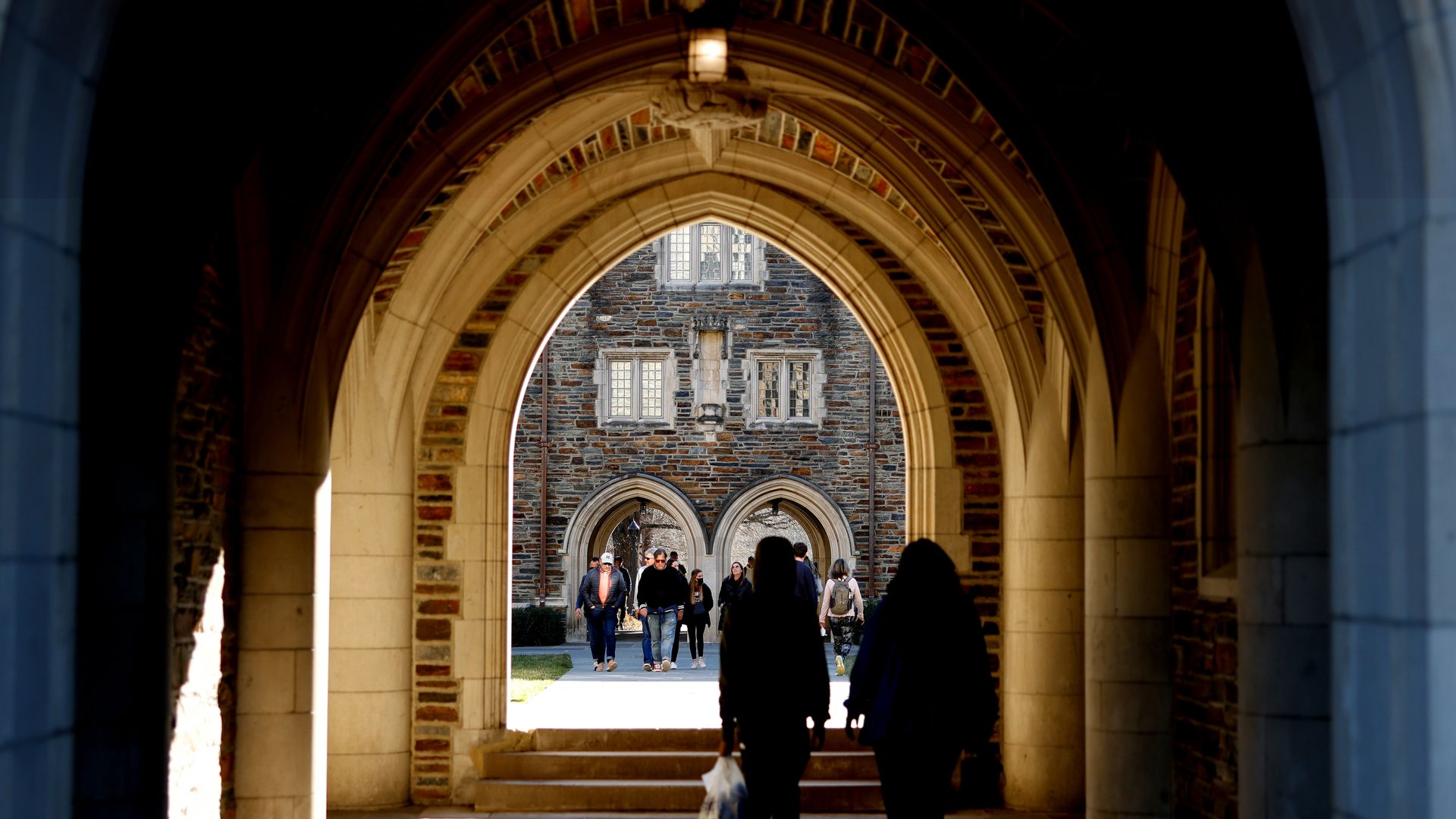 DURHAM, NC - FEBRUARY 19: People walk through the campus of Duke University ahead of the game between the Florida State Seminoles and the Duke Blue Devils on February 19, 2022 in Durham, North Carolina. (Photo by Lance King/Getty Images)
