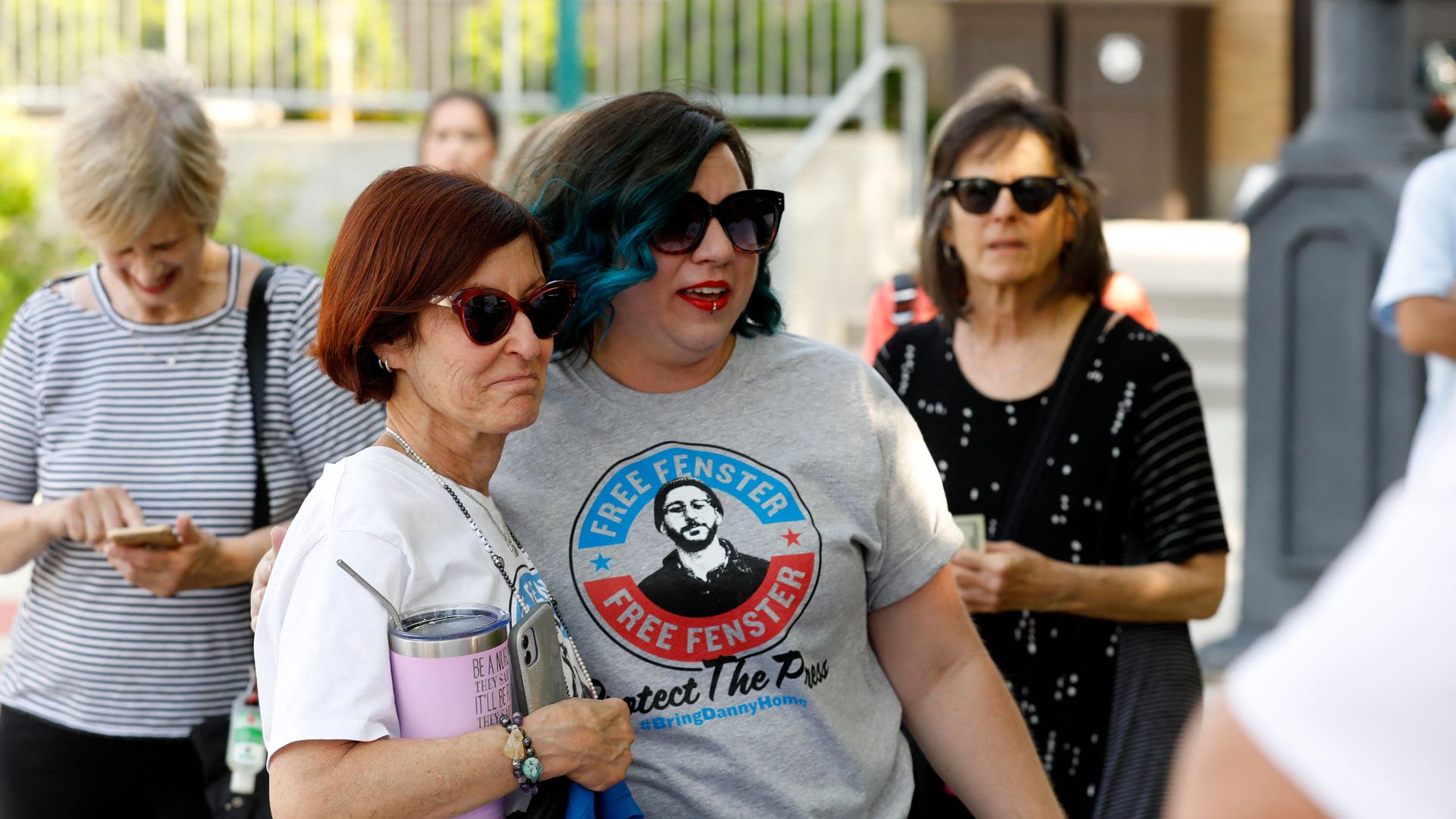 Rose Fenster (L), mother of journalist Danny Fenster, who's detained in Myanmar, stands with supporters in Huntington Woods, Michigan, on June 4