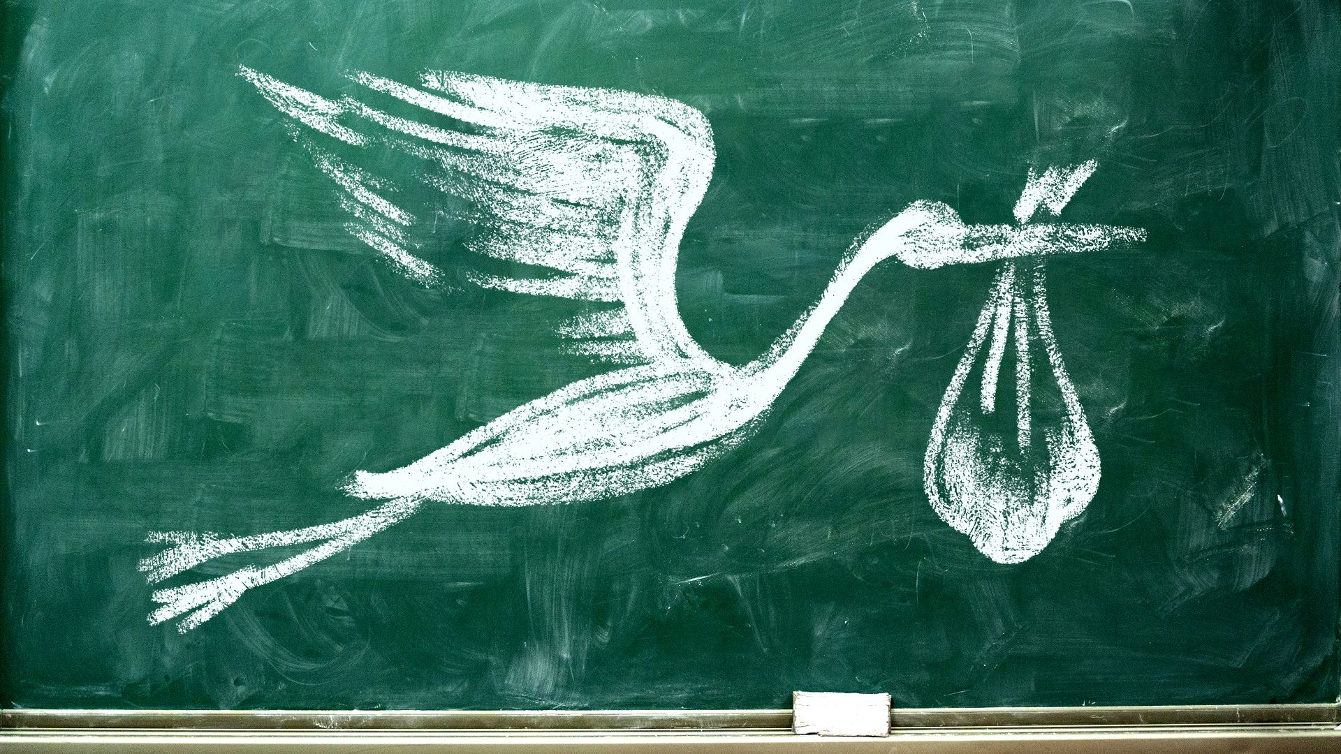 Illustration of a stork carrying a bundle drawn in chalk on a chalkboard.