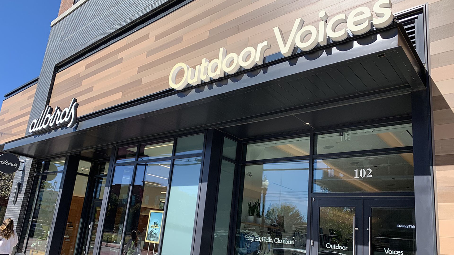 A photo of a store with the name Outdoor Voices above the door