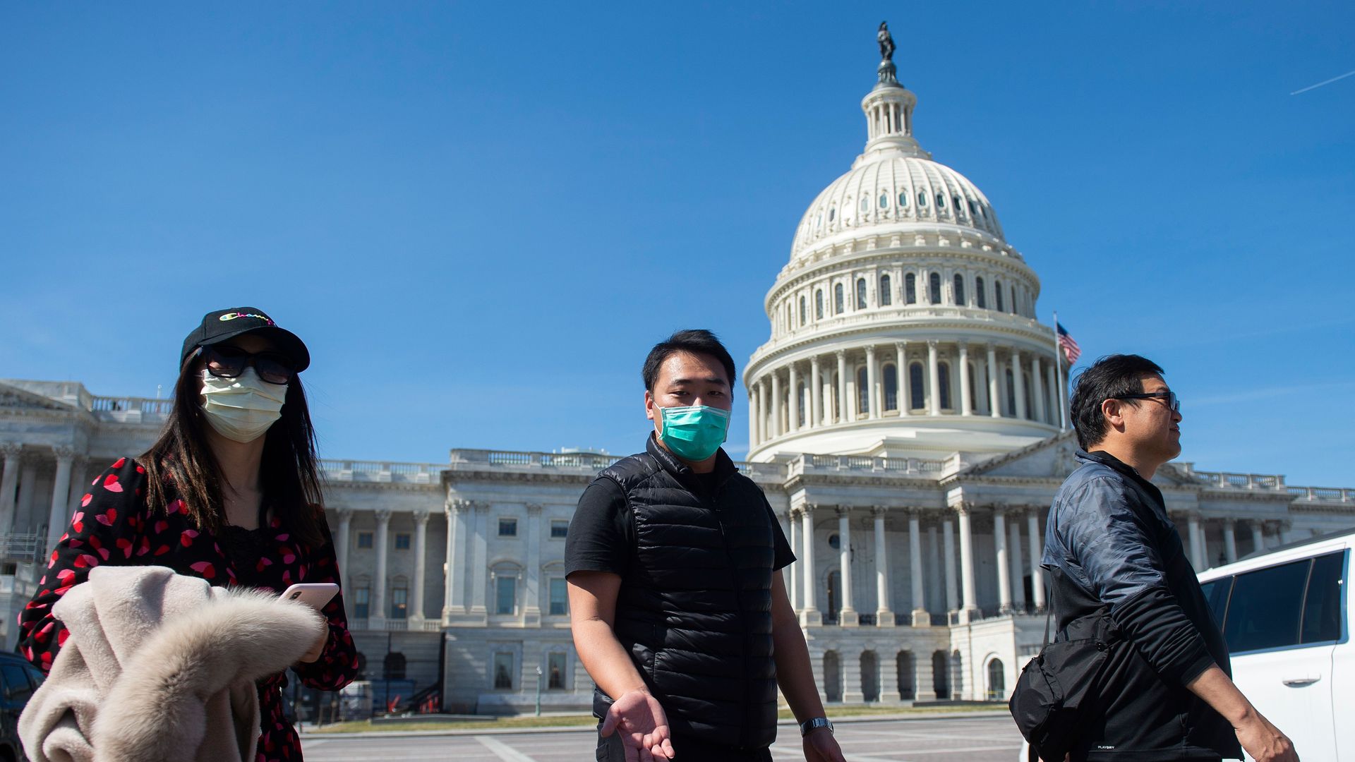 People wearing face masks outside Congress