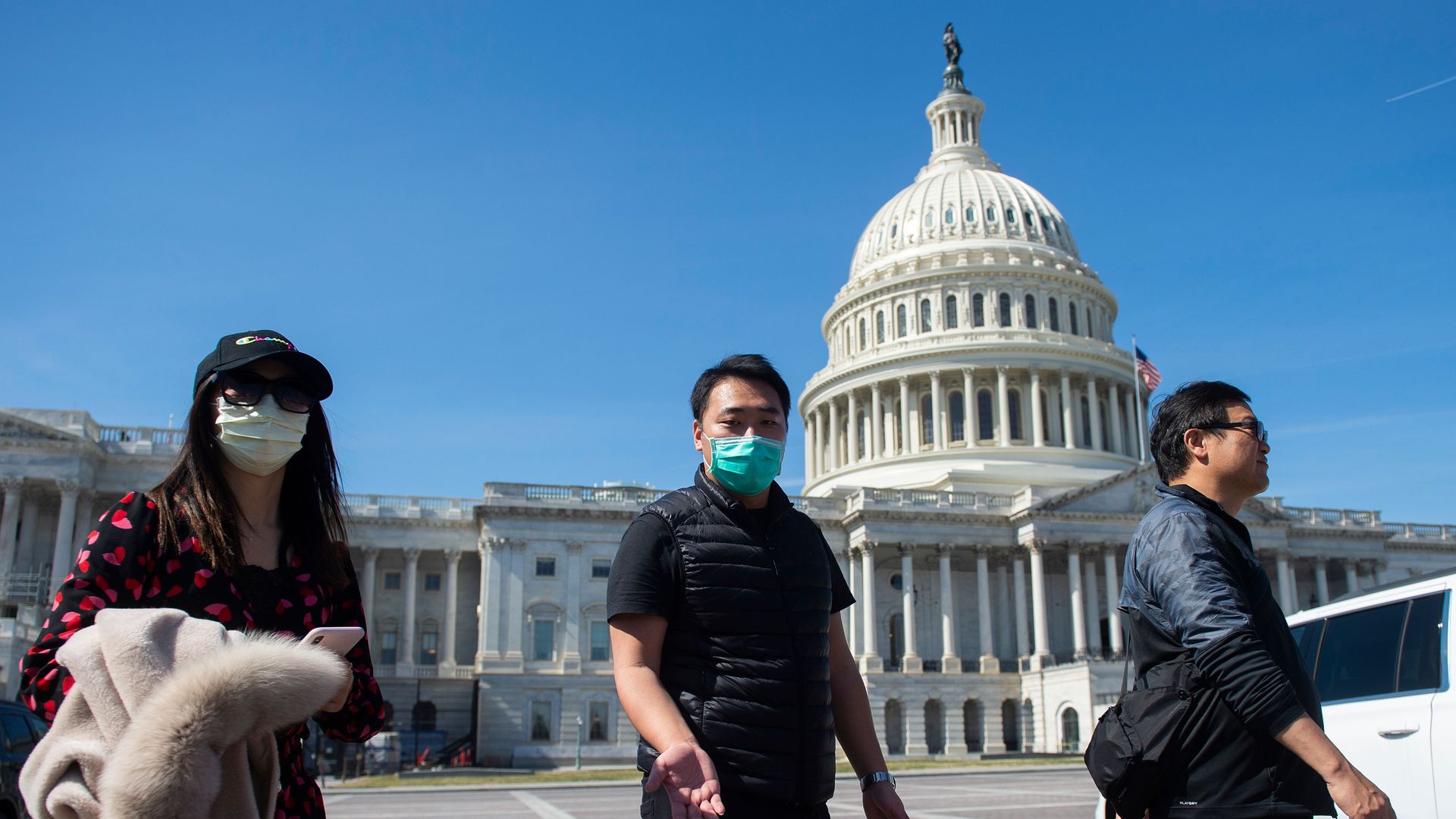 People wearing face masks outside Congress