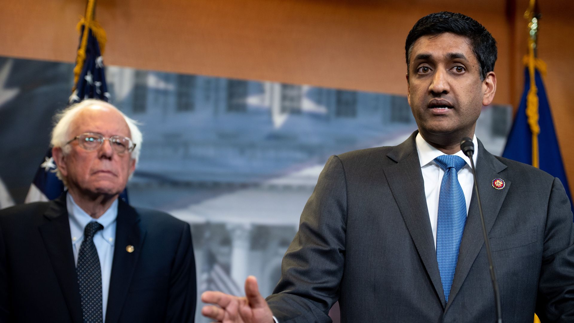 In this image, Sanders and Ro Khanna stand together at a podium